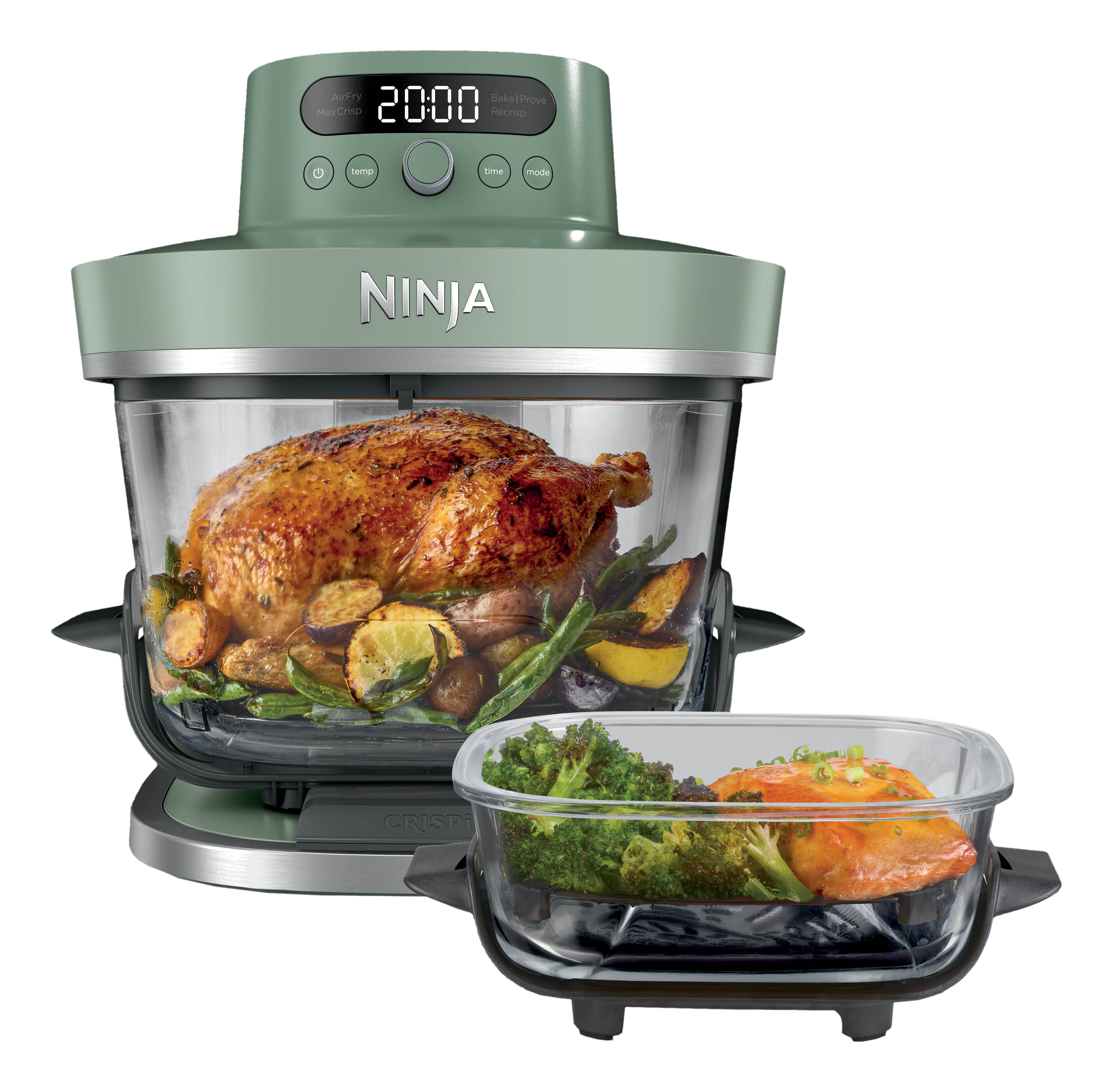 Une friteuse à air Ninja verte avec un poulet rôti entier et des légumes, et un plat séparé de saumon et de brocoli.