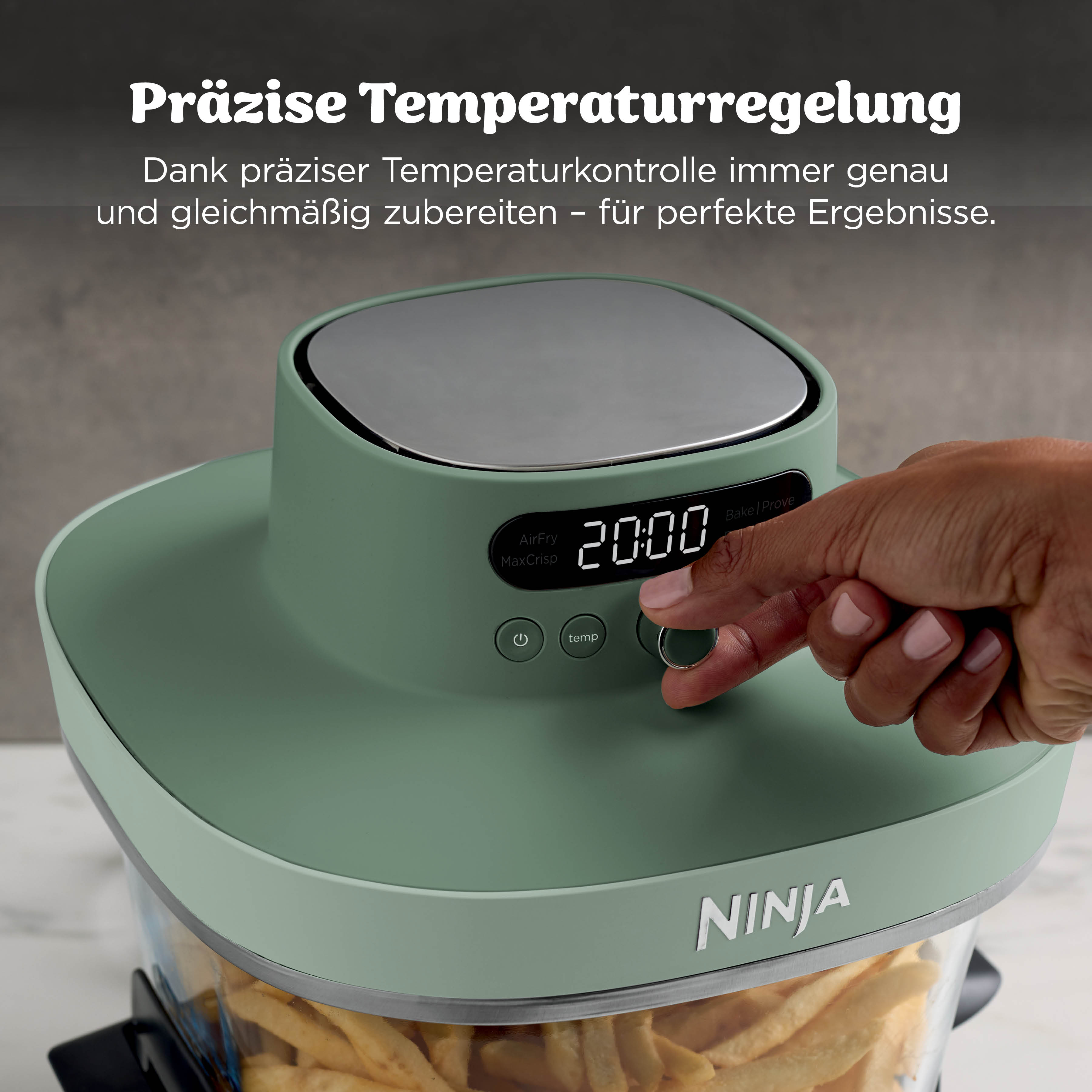 Une friteuse à air verte avec un écran affichant 20:00. Une main ajuste les réglages.