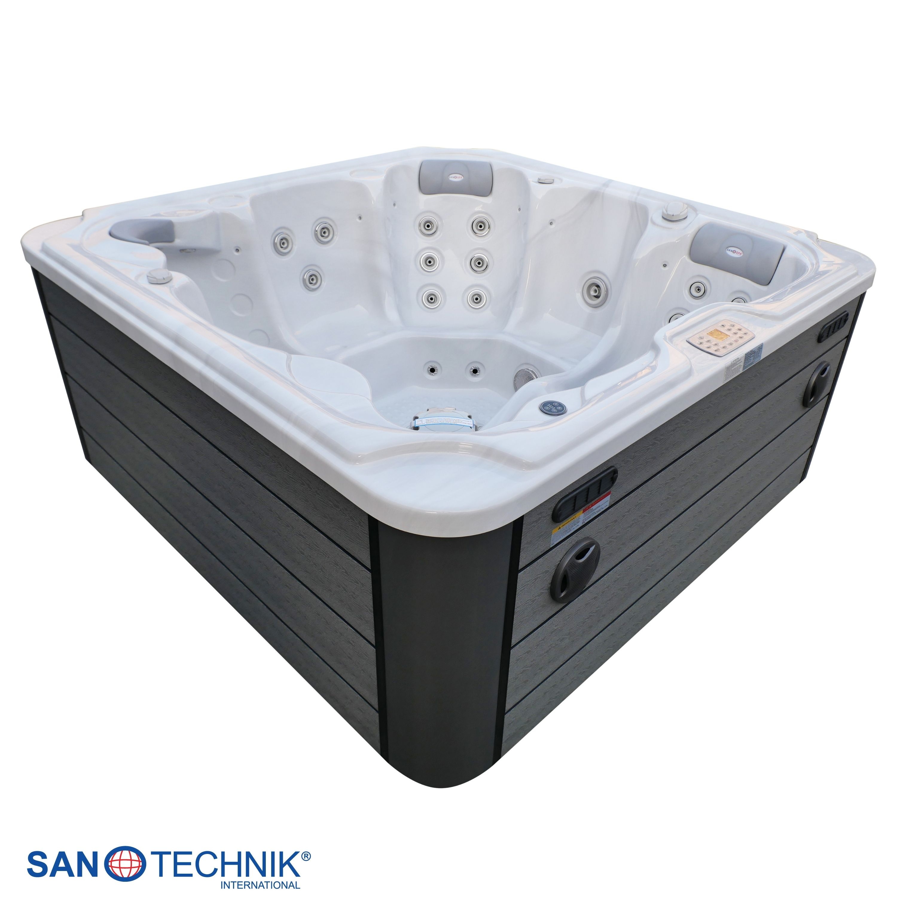Ein weißer Whirlpool mit dunkler Verkleidung und Düsen.