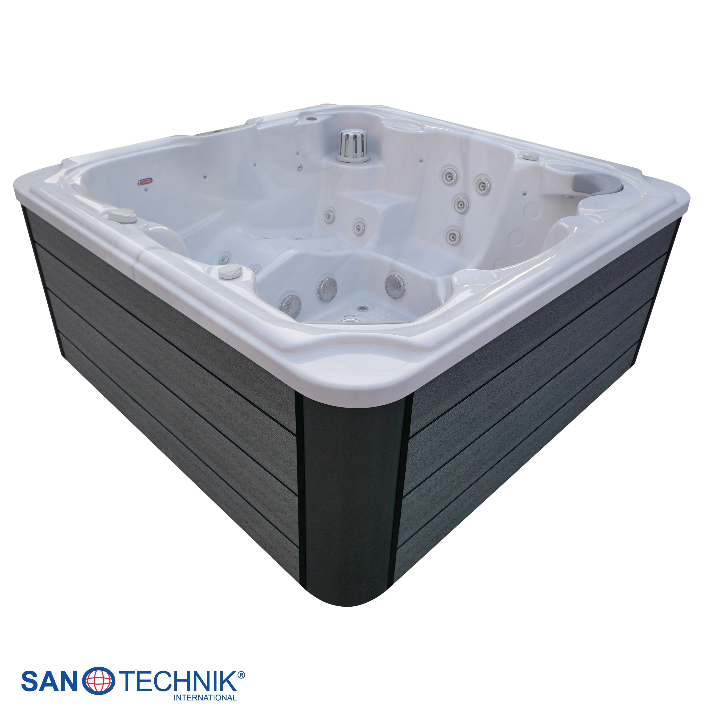 Ein weier Whirlpool mit dunklen Seitenwänden und vielen Jets.