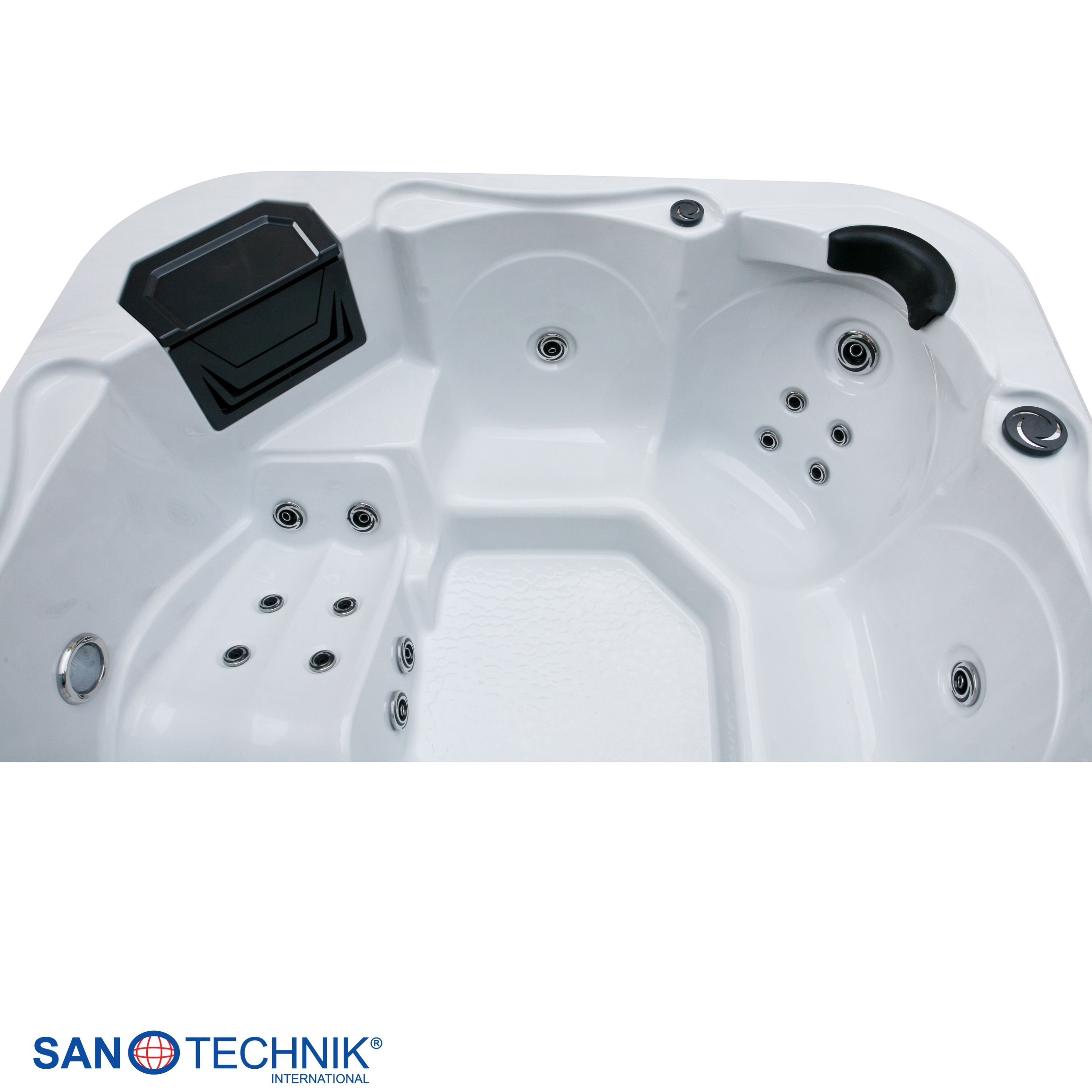 Ein weißer Whirlpool mit schwarzen Akzenten und mehreren Düsen.