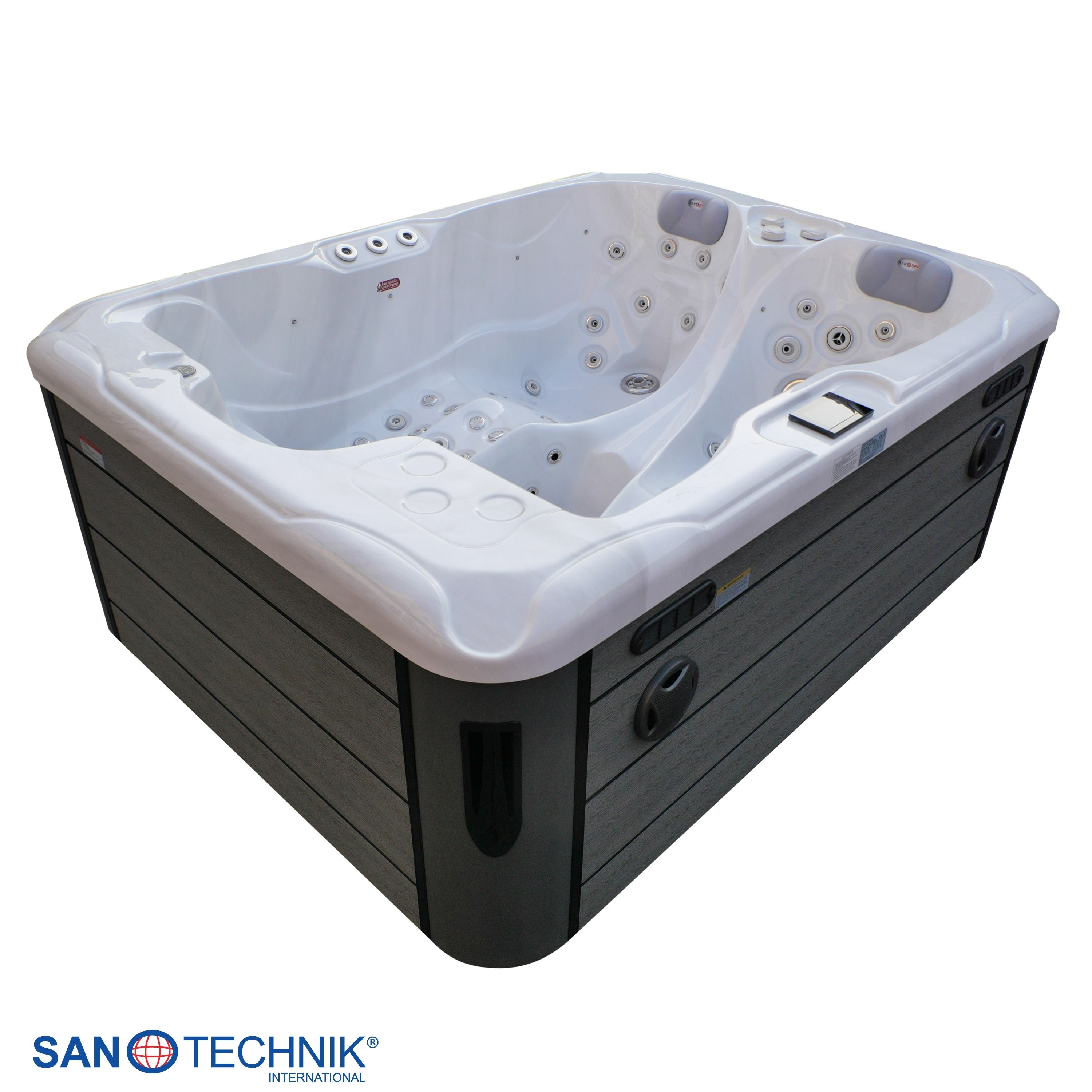 Ein weißer Whirlpool mit dunkler Verkleidung und mehreren Düsen.