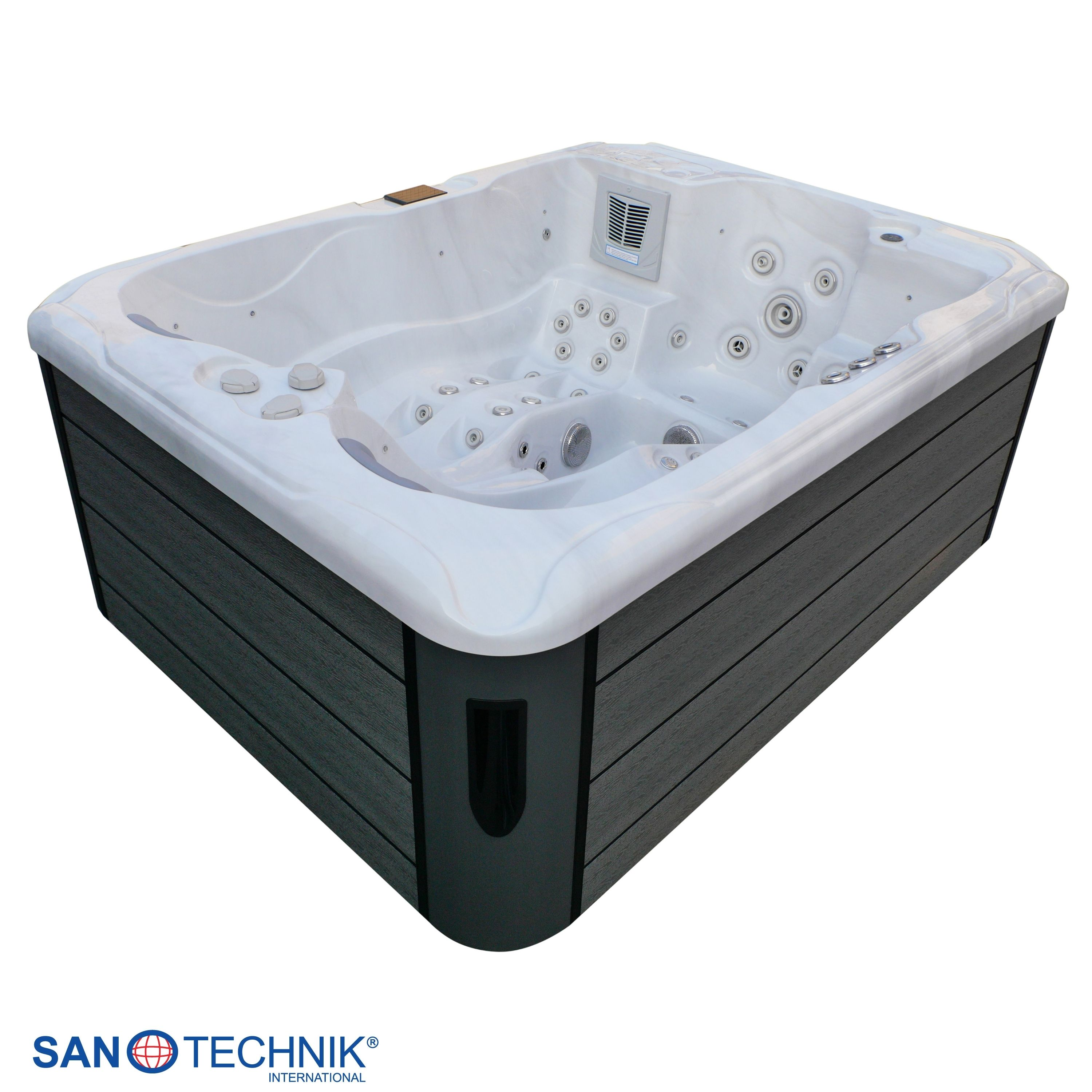 Ein weißer Whirlpool mit dunkler Verkleidung und vielen Düsen.