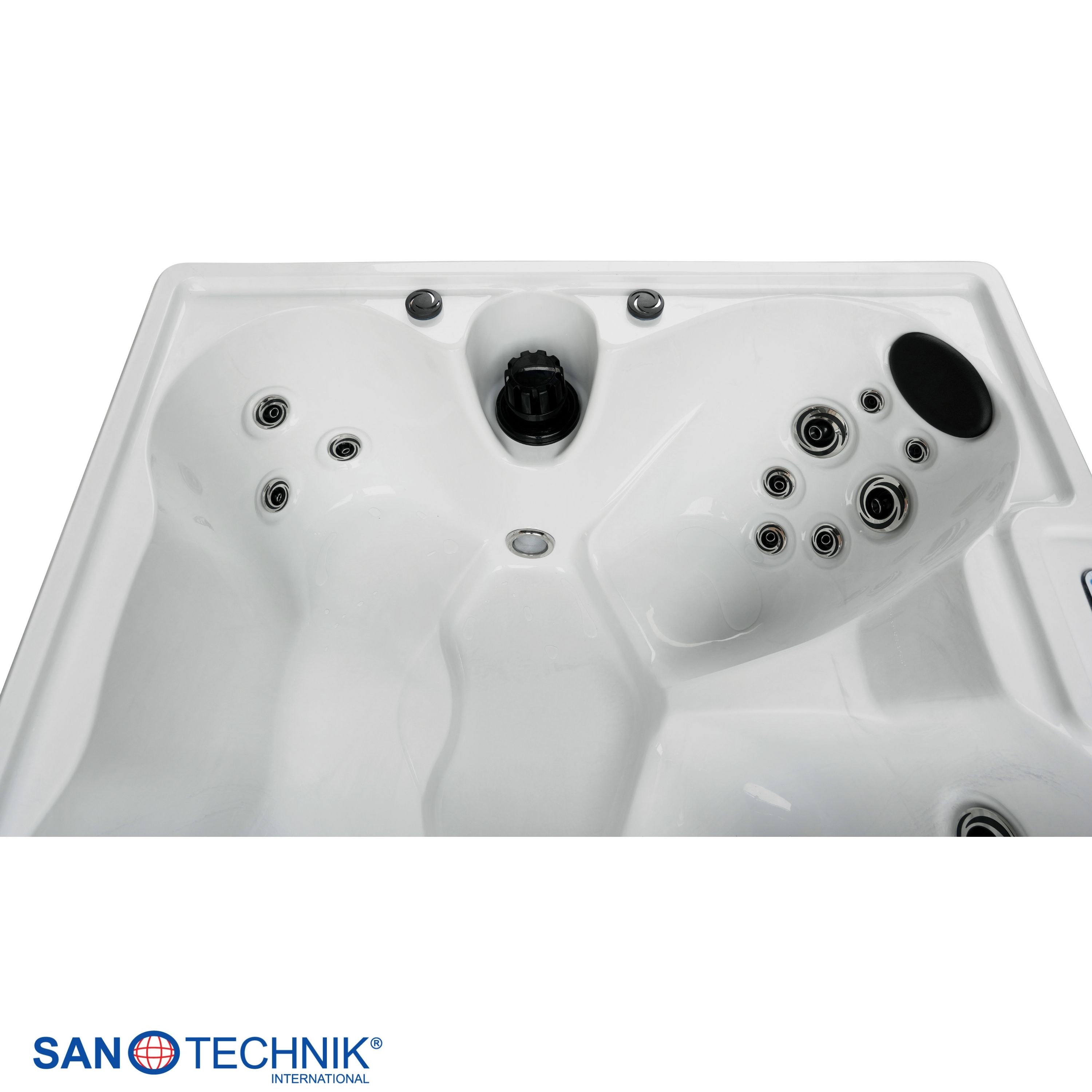 Eine weiße Whirlpool-Badewanne mit mehreren Düsen und einem schwarzen Abfluss.