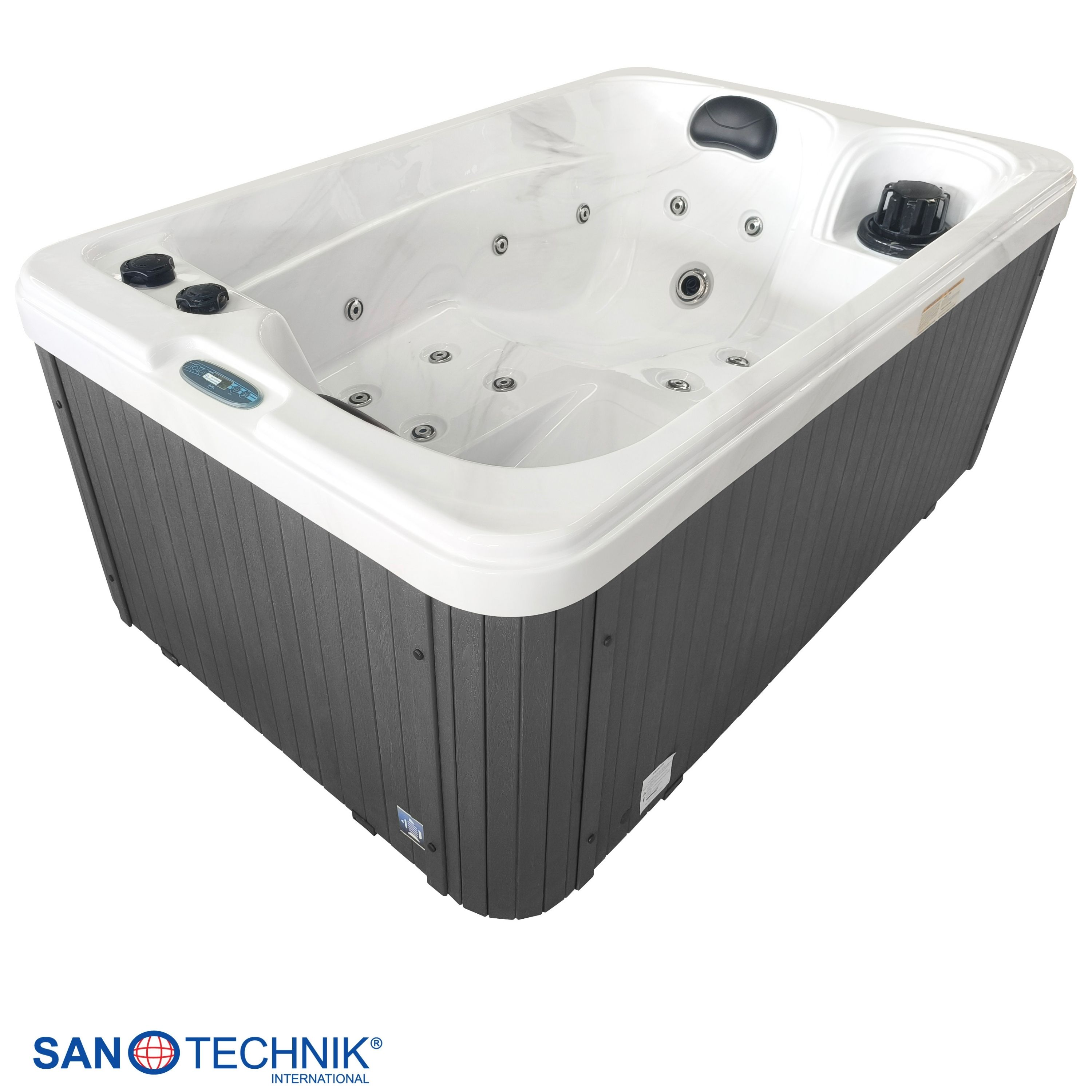Eine weiße Whirlpool-Wanne mit grauer Verkleidung und Düsen.