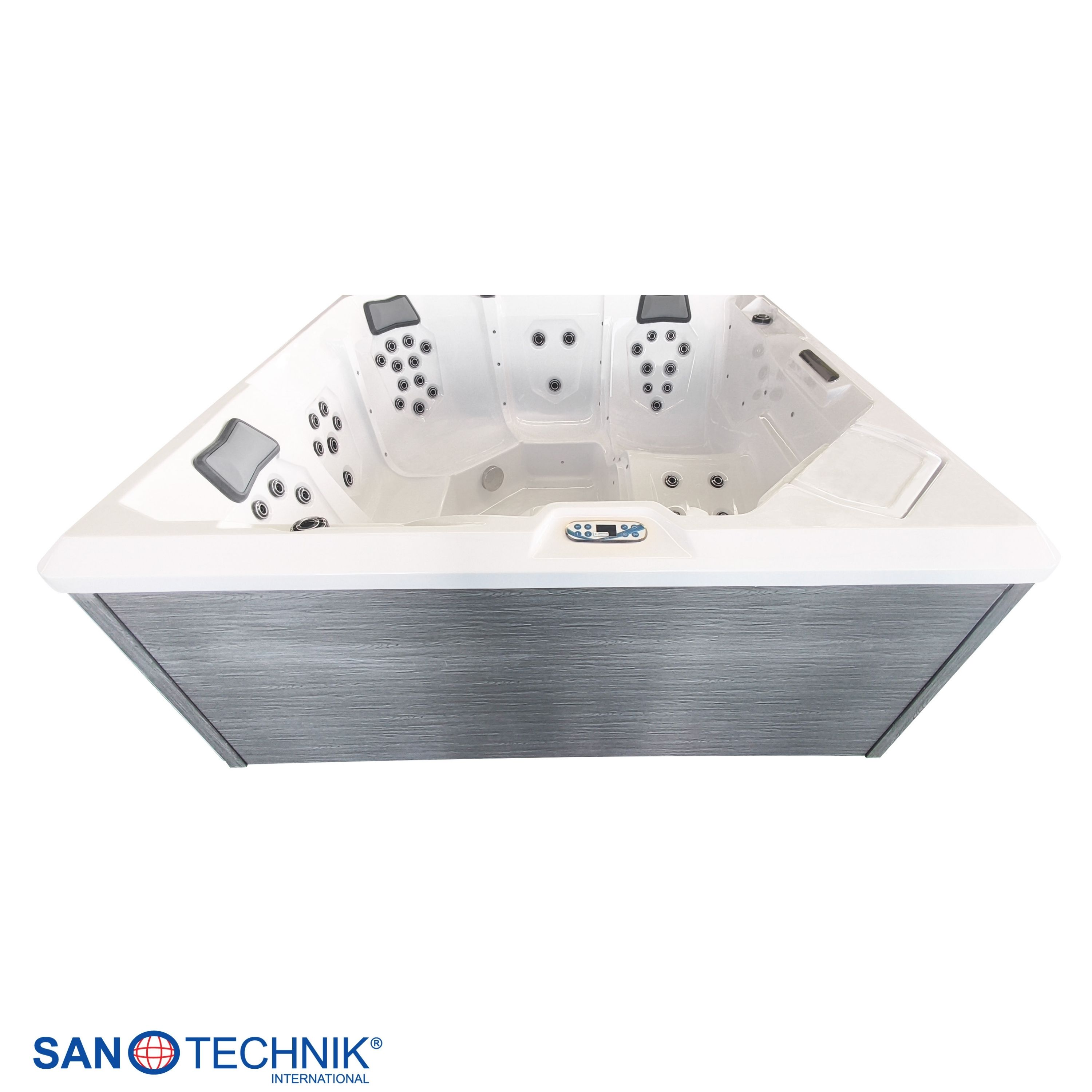 Ein moderner, weißer Whirlpool mit grauer Verkleidung und mehreren Düsen.