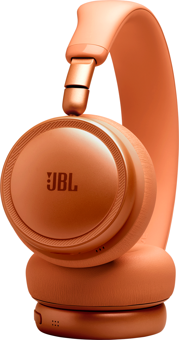 Casque JBL orange avec texture détaillée sur les oreillettes, sur fond noir.