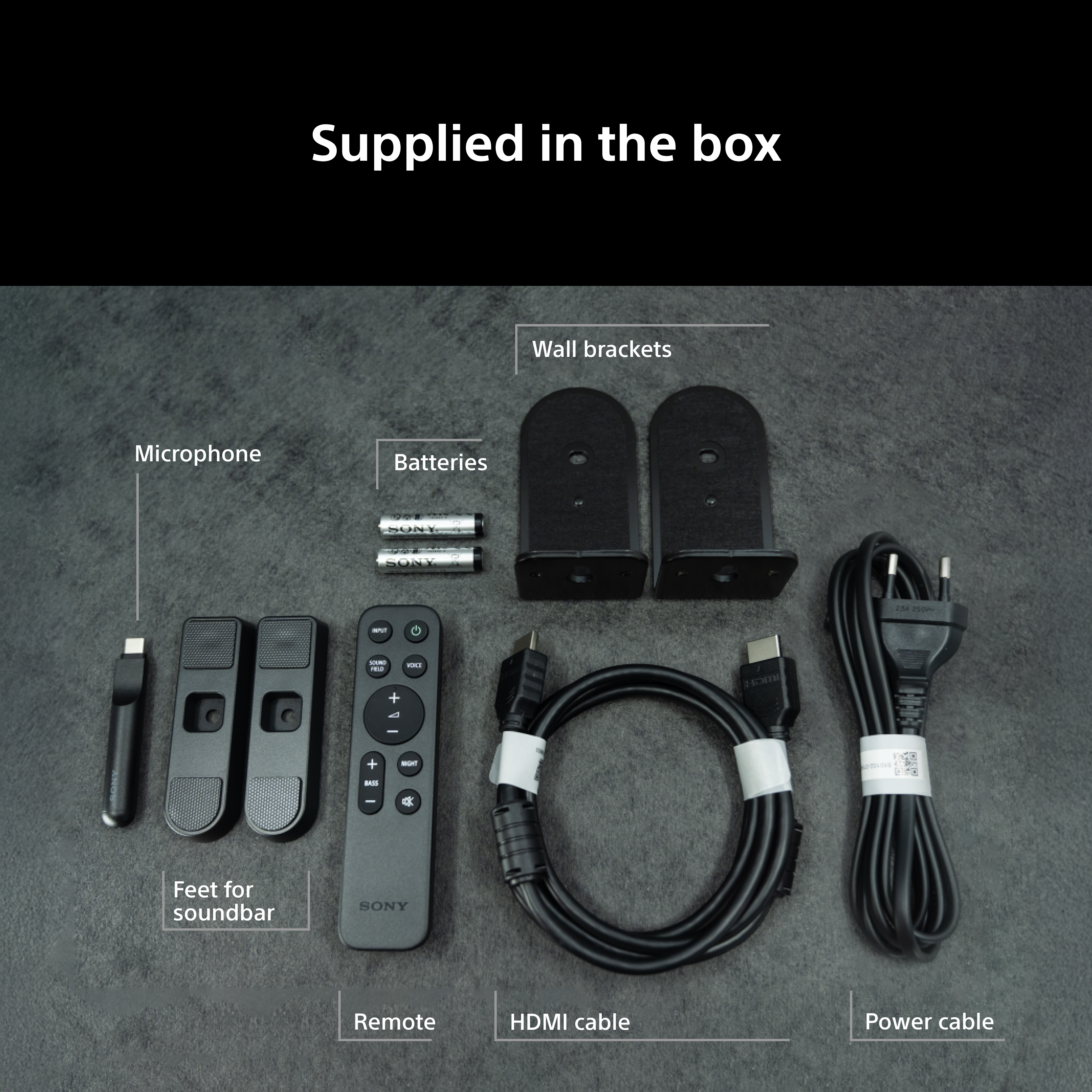 Contenu de la boîte : Microphone, piles, supports muraux, télécommande, câbles HDMI et d'alimentation.