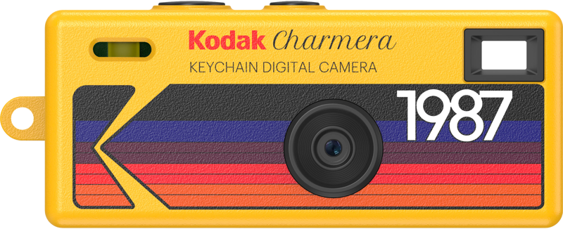 Żółty cyfrowy aparat brelok Kodak Charmara z napisem 1987 i paskami.