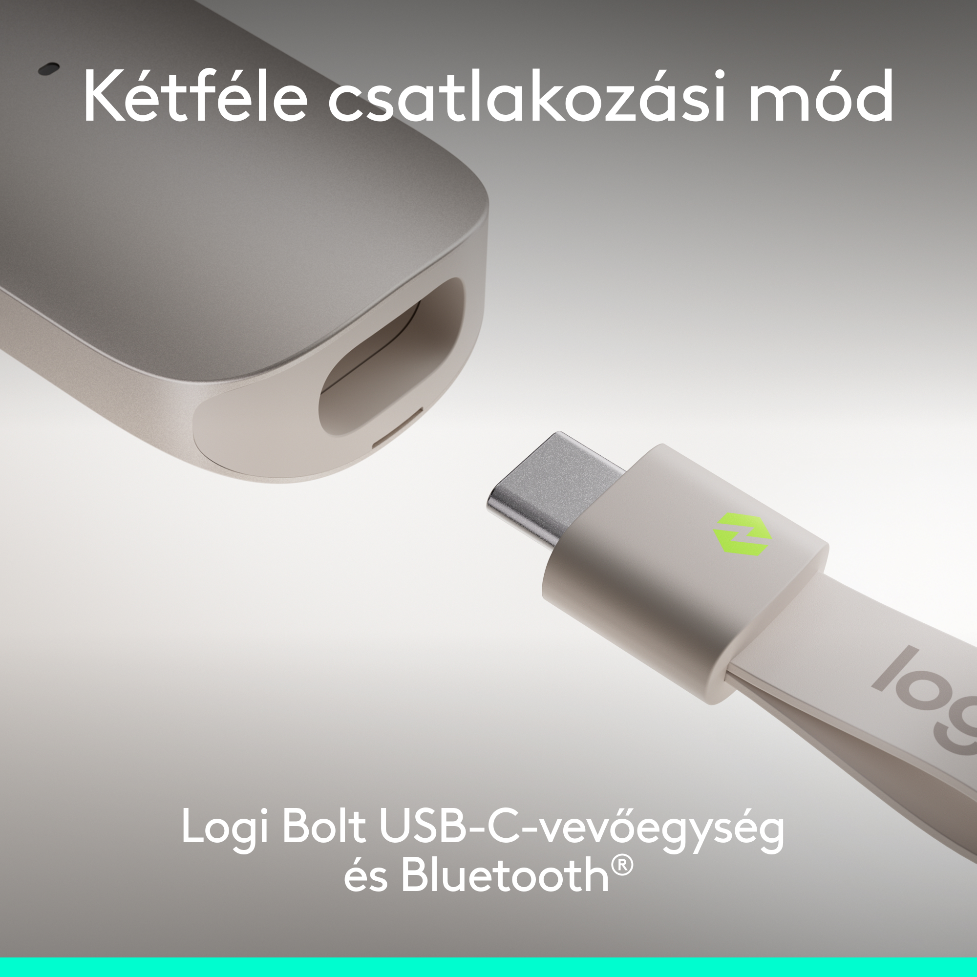 Egy ezüst színű, Logi logós USB-C hardverkulcs egy vevőegység előtt.