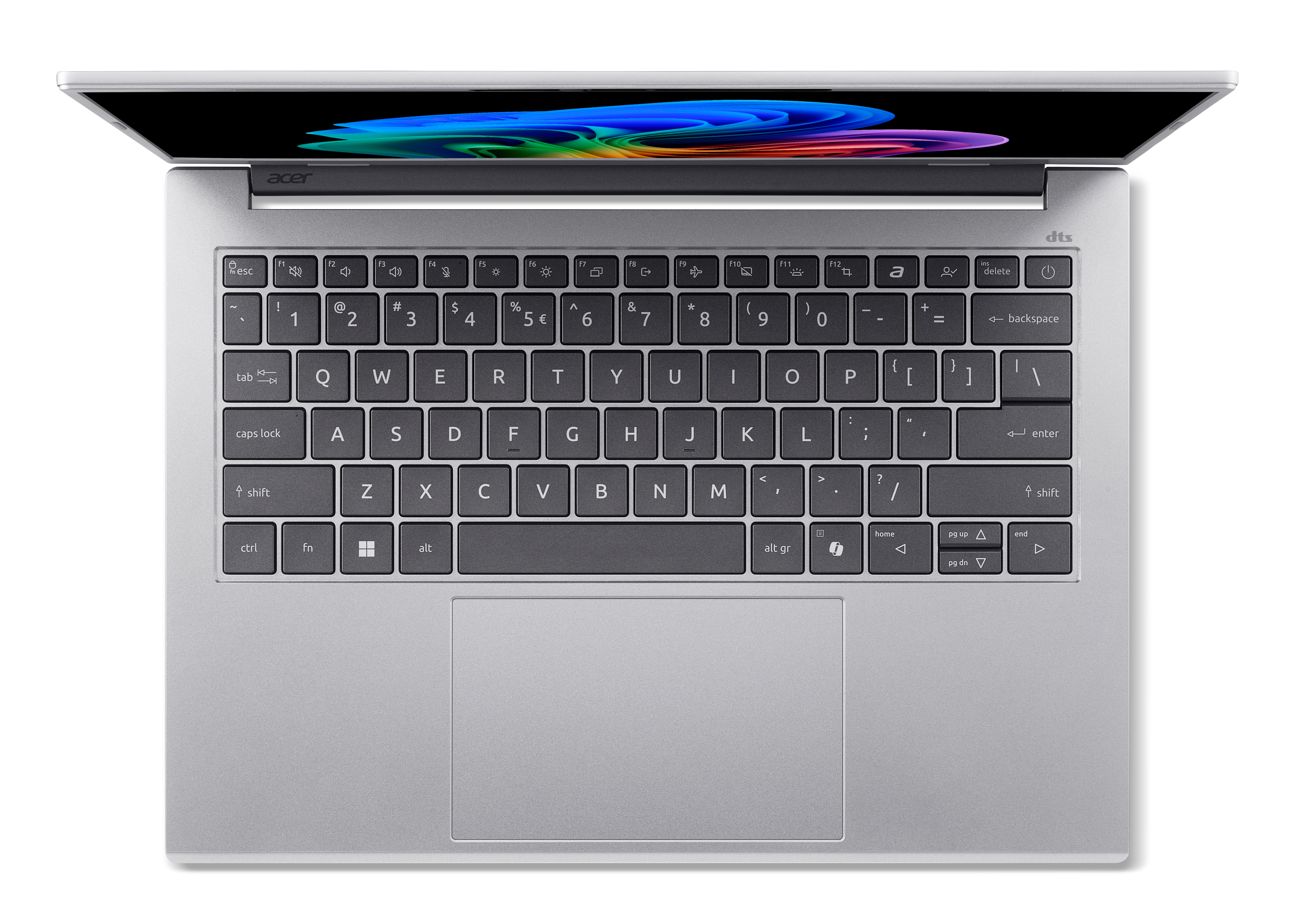 Srebrny laptop widziany z góry, z podświetlanym ekranem i klawiaturą.