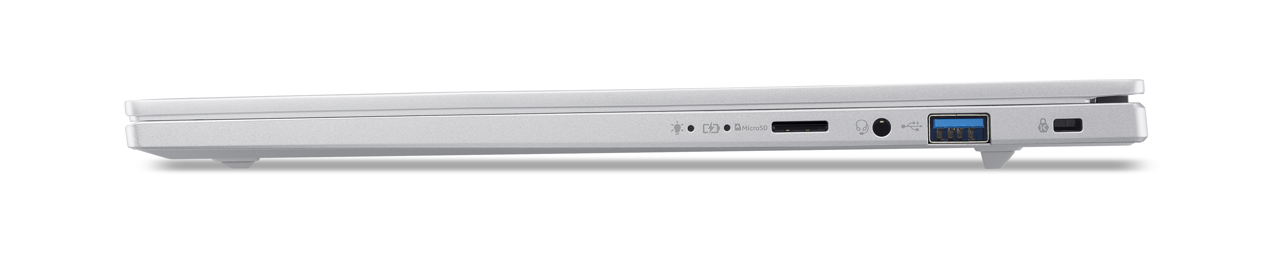 Srebrny laptop z boku, widoczne porty: słuchawki, USB, MicroSD.