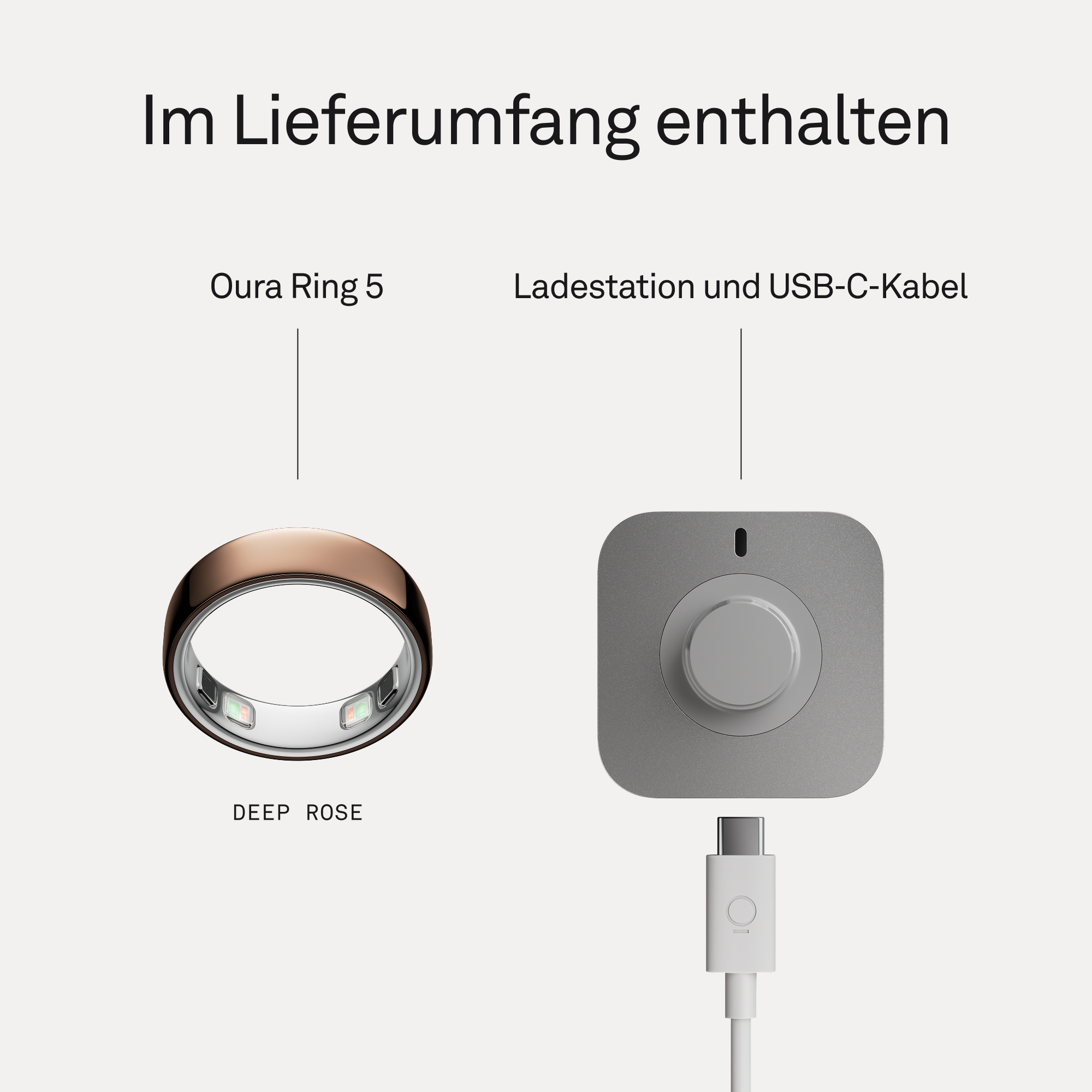 Oura Ring 5 und Ladestation mit USB-C-Kabel auf hellem Grund.