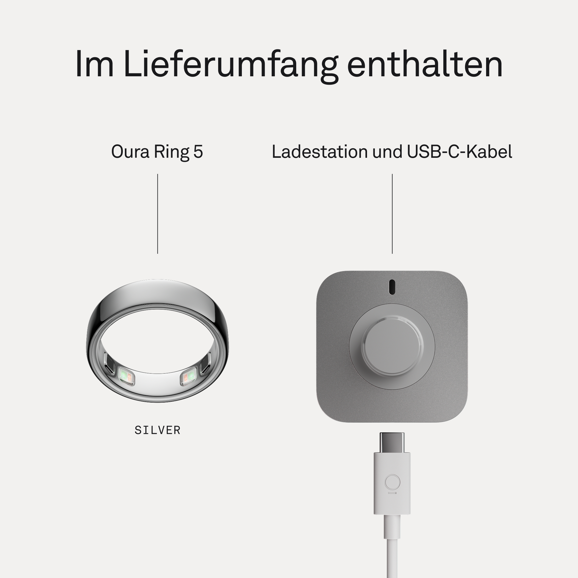 Silberner Oura Ring 5 und graue Ladestation mit USB-C-Kabel.