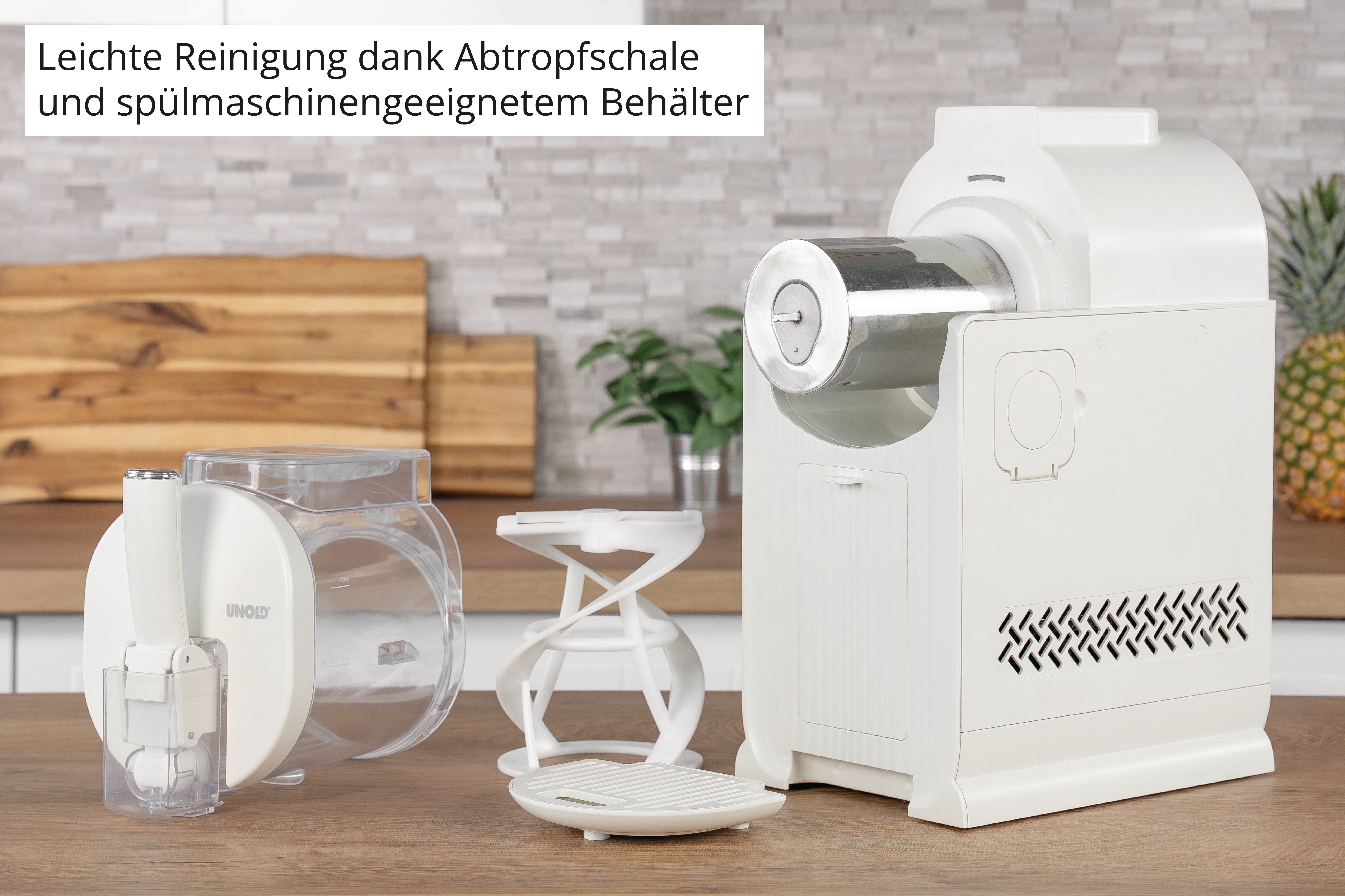 Weißer Küchenhelfer mit transparenten Behältern und Metallaufsatz.