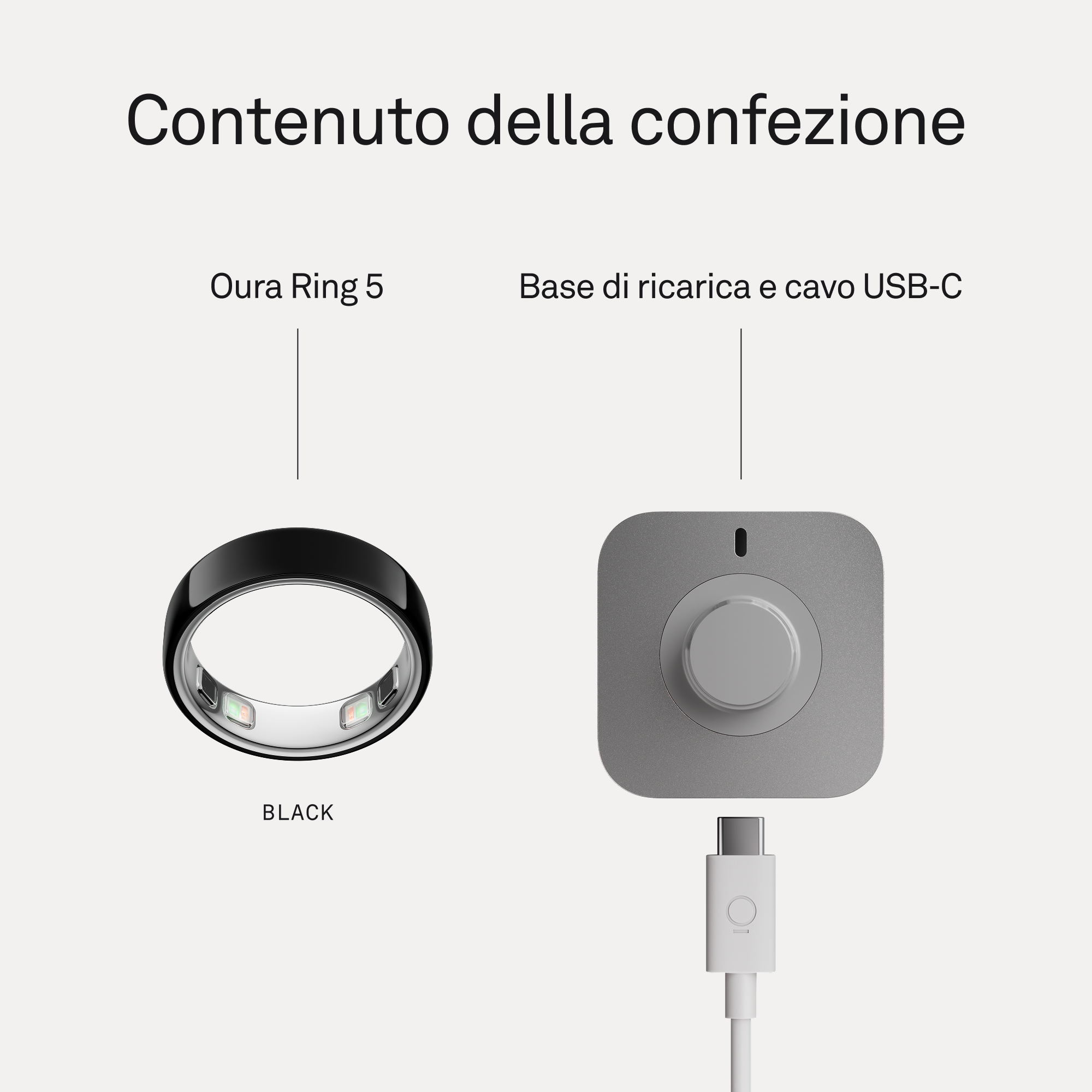 Un Oura Ring 5 nero accanto a una base di ricarica grigia con cavo USB-C.