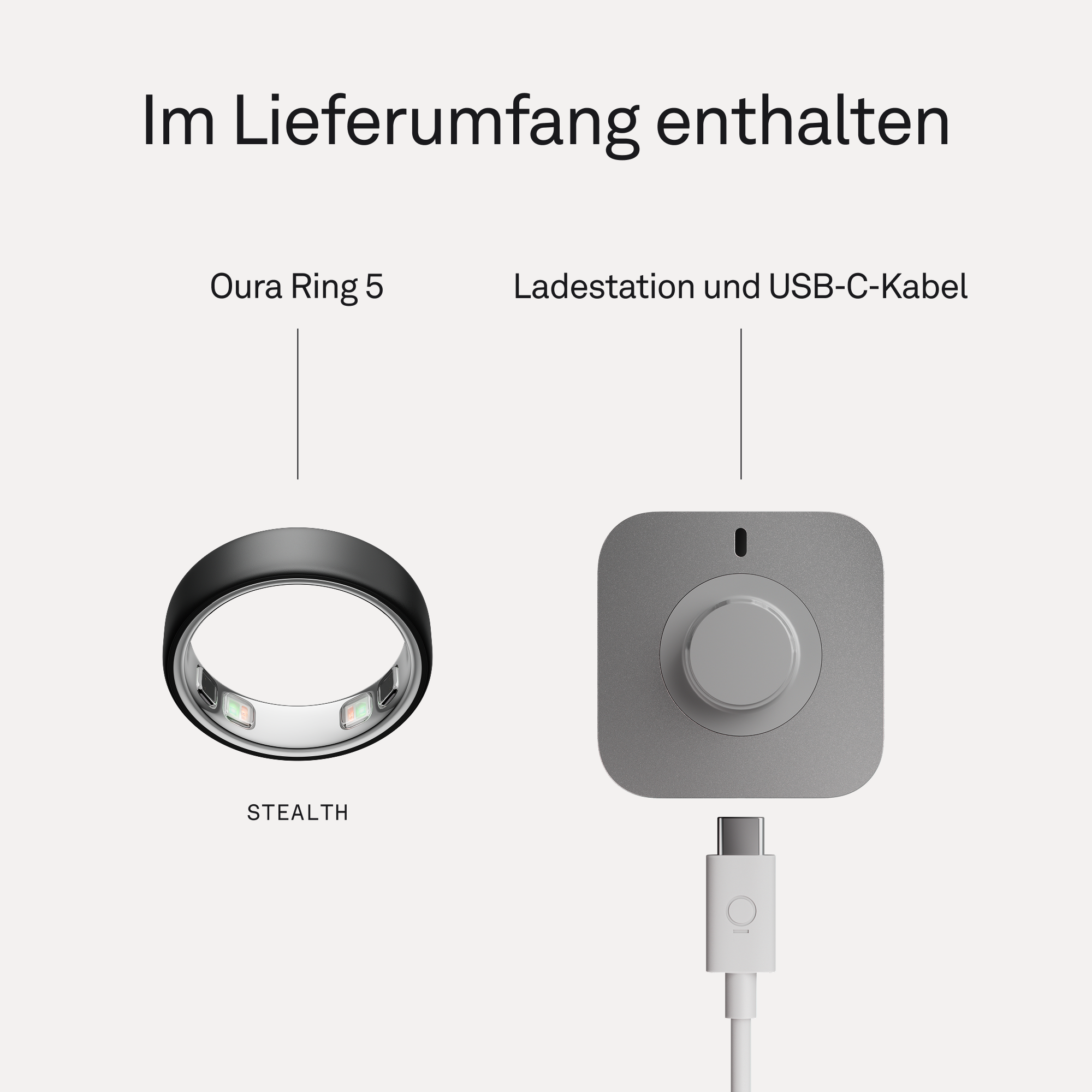 Schwarzer Oura Ring 5 neben einem grauen Ladegerät mit USB-C-Kabel.