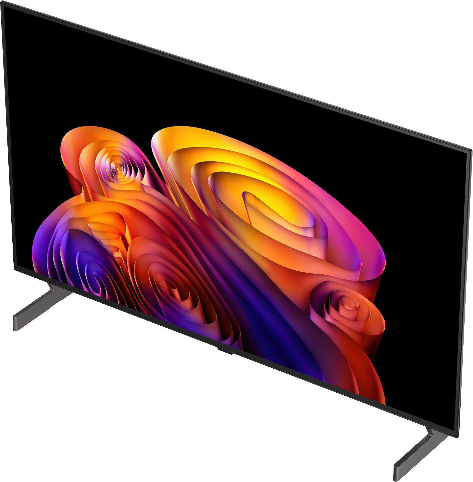Ein moderner Fernseher mit einem abstrakten, bunten Bildschirmschoner auf schwarzem Hintergrund.