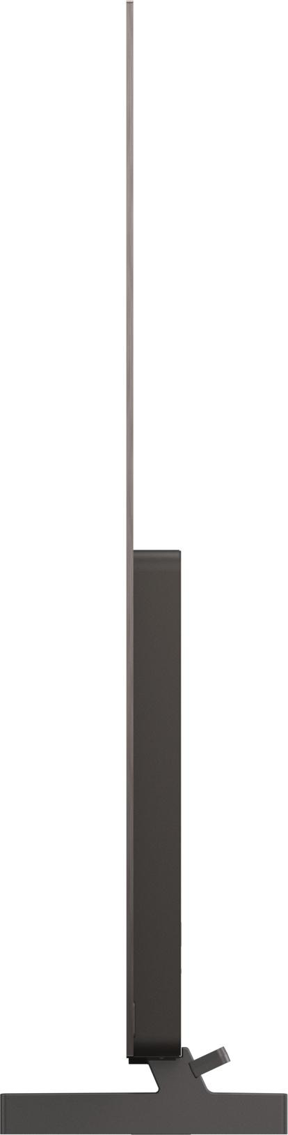 Schwarzer Fernseher mit schmalem Standfuß, von der Seite gesehen.
