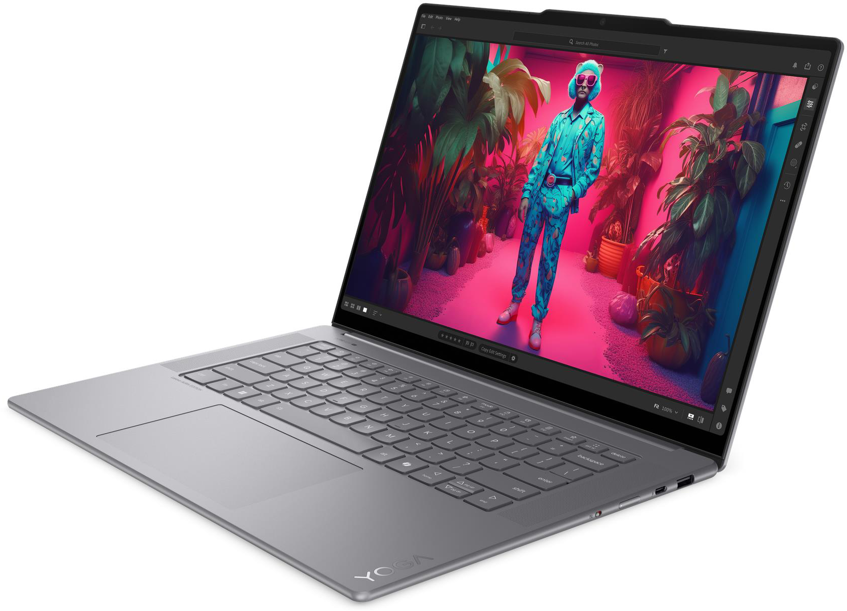 Egy laptop, amelynek képernyőjén egy színes kép látható egy öltönyös személyről.