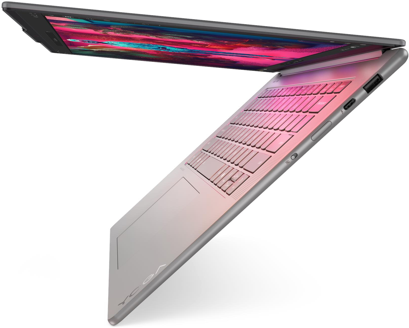 Egy nyitott, ezüst laptop rózsaszín billentyűzettel és színes képernyővel.