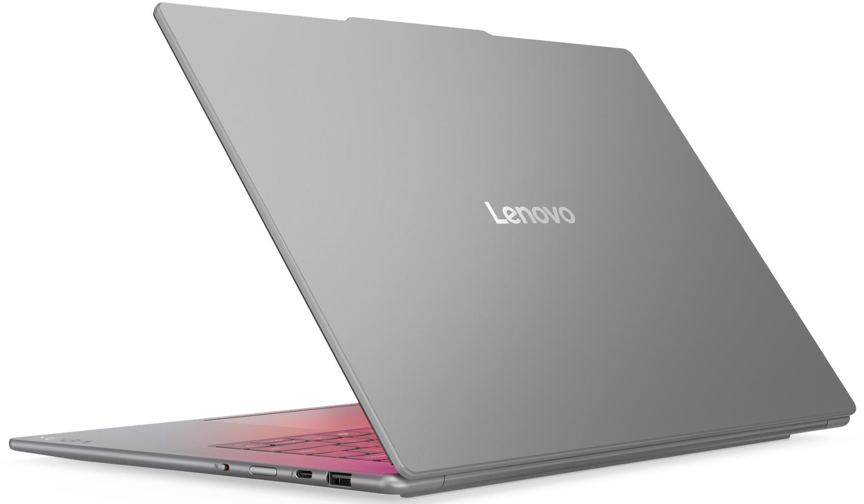 Egy szürke Lenovo laptop nyitva, rózsaszín világító billentyűzettel.