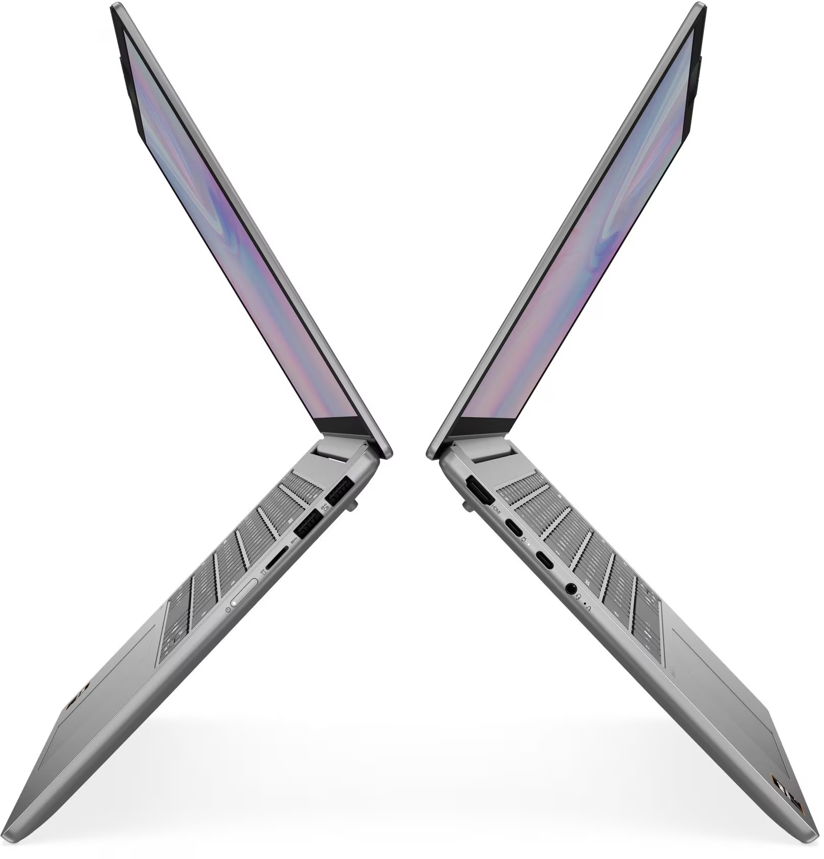 Két ezüst laptop egymás felé döntve, billentyűzetek láthatóak.
