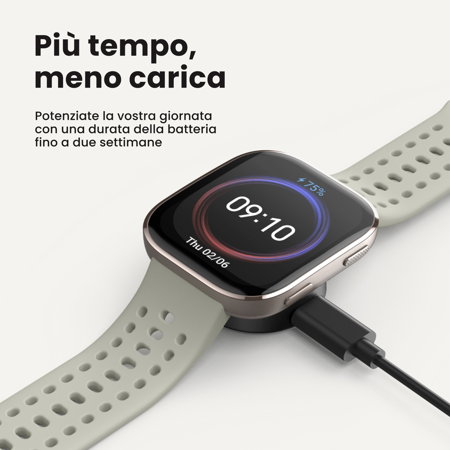 Uno smartwatch grigio collegato a un caricabatterie, con 75% di batteria.