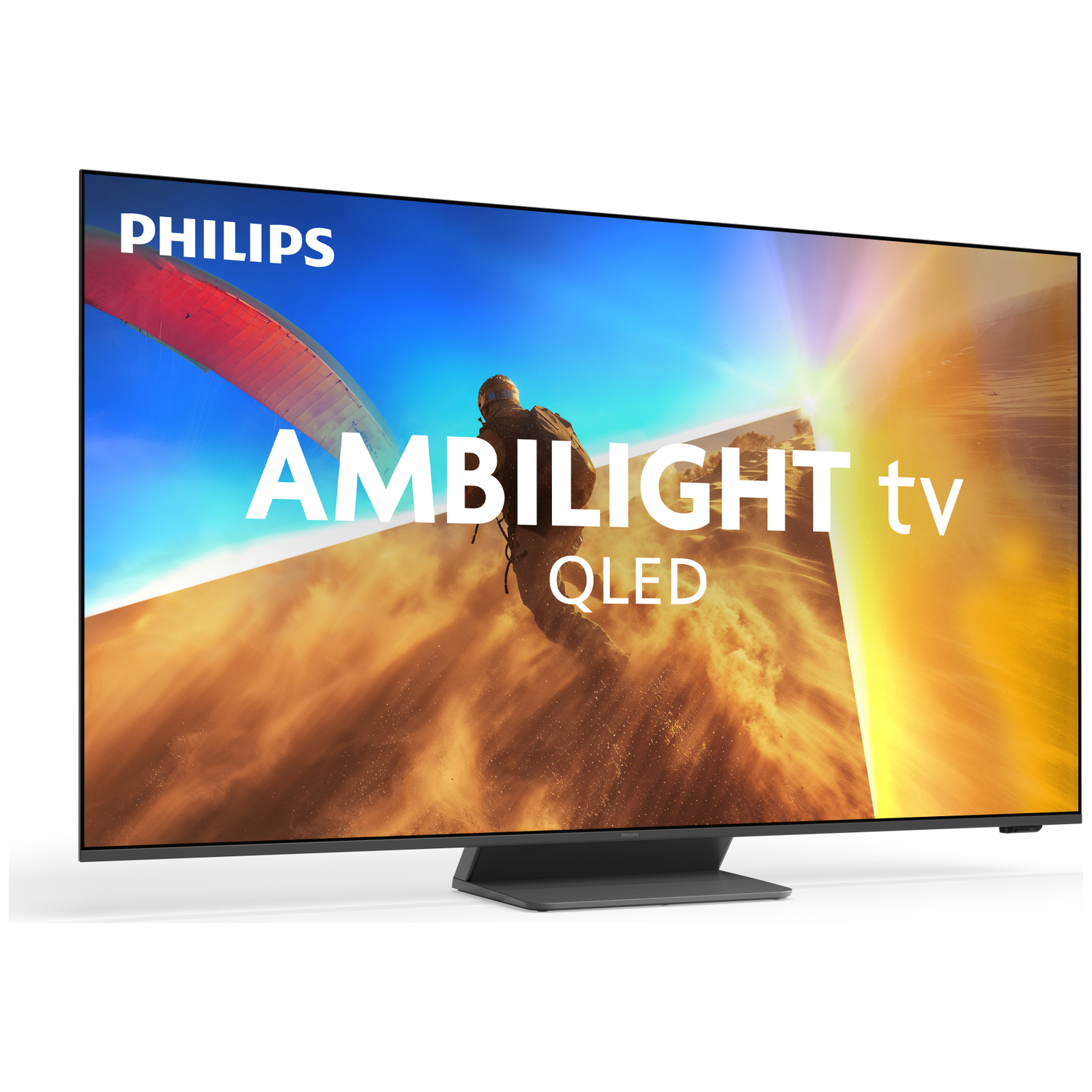 A Philips Ambilight QLED TV displays a paraglider in a desert landscape.