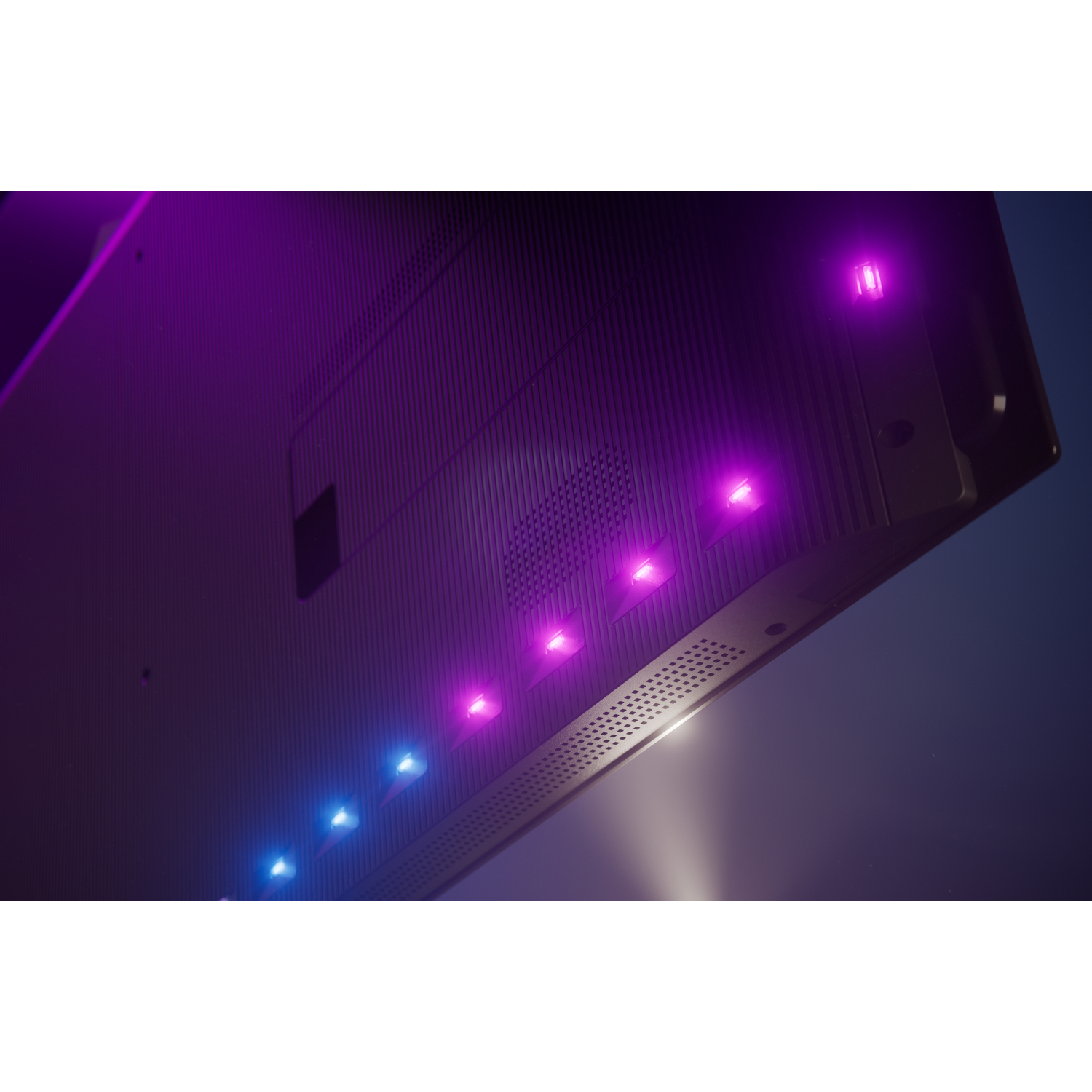 Underside of a TV with blue and purple LEDs, vents, and ribbed texture.