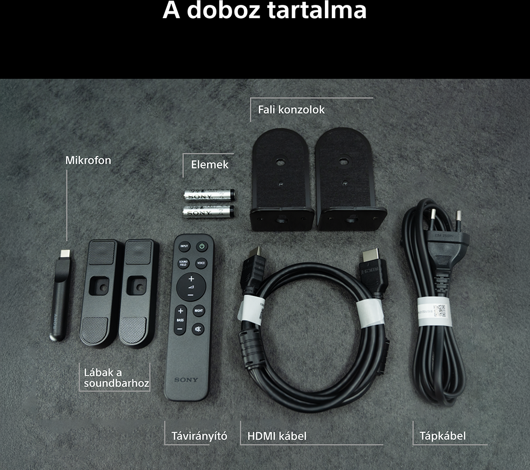 Doboz tartalma: Mikrofon, elemek, fali konzolok, lábak, távirányító, HDMI kábel, tápkábel.
