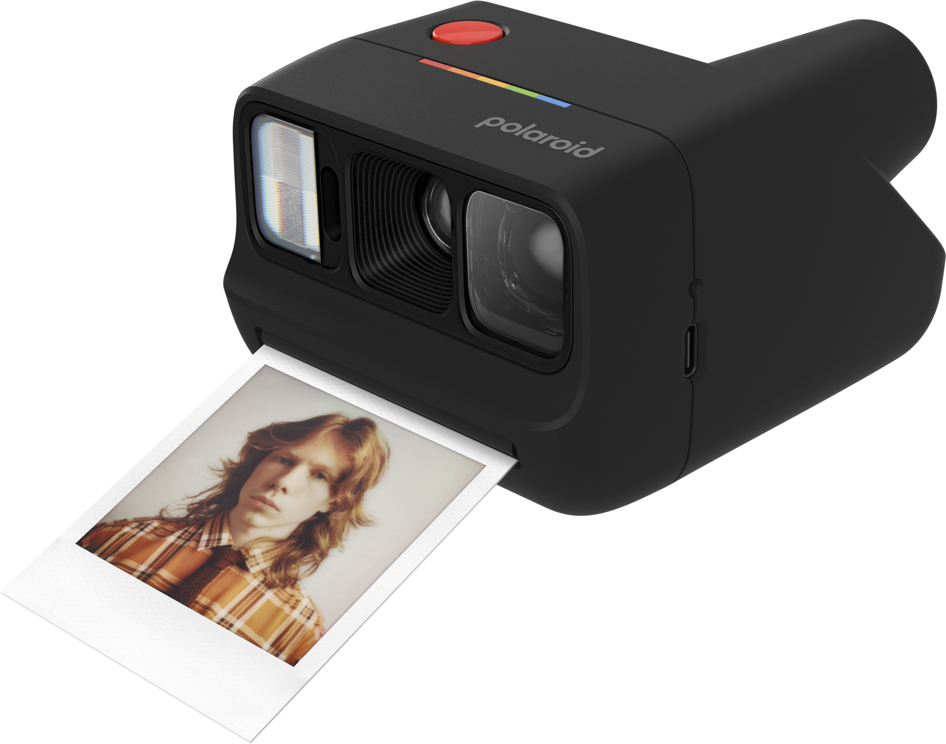 Czarny aparat Polaroid z młodym mężczyzną z długimi włosami na zdjęciu.