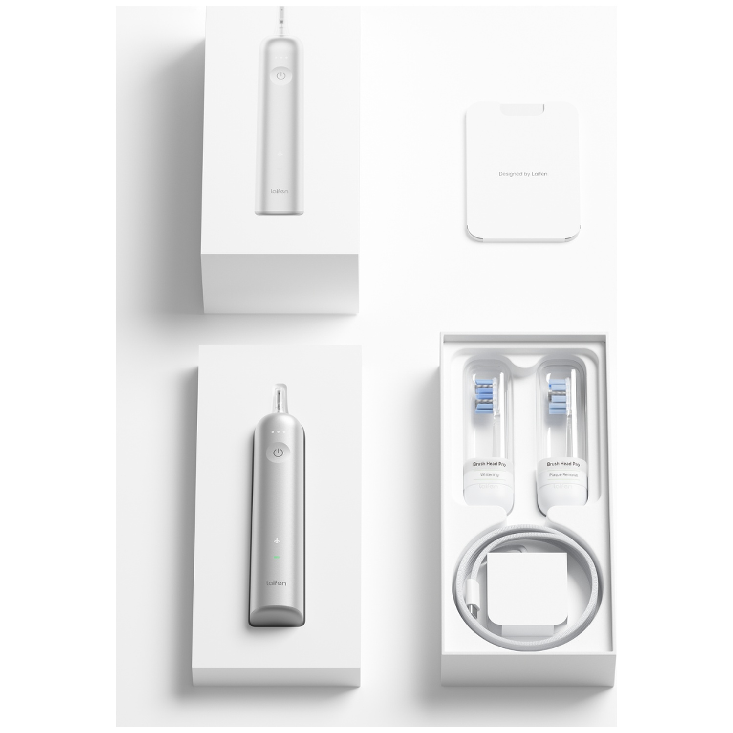 A white electric toothbrush set with accessories, arranged in white boxes.