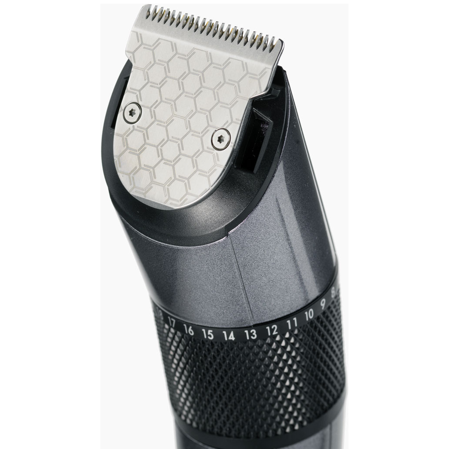 Close-up of a dark hair clipper with a silver cutting head and adjustment ring.