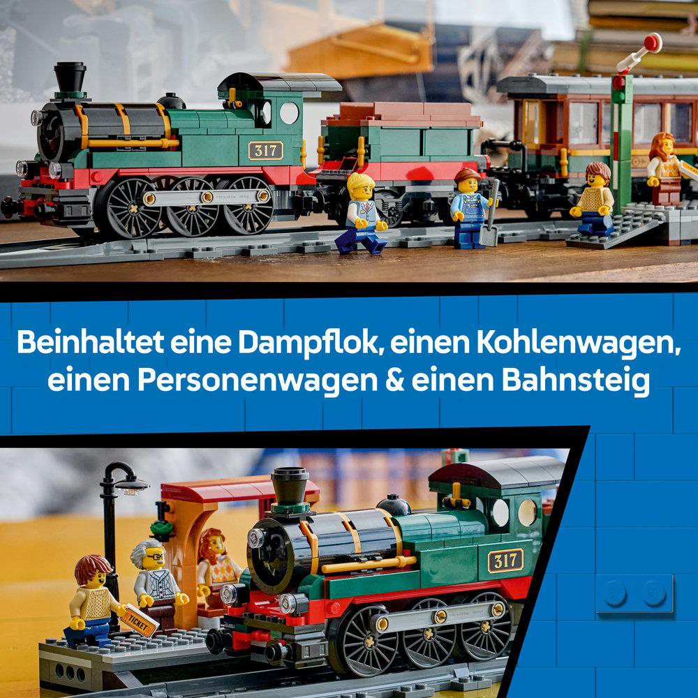 Modell-Dampflokomotive mit Waggons und Figuren auf Schienen, mit Bahnsteig.