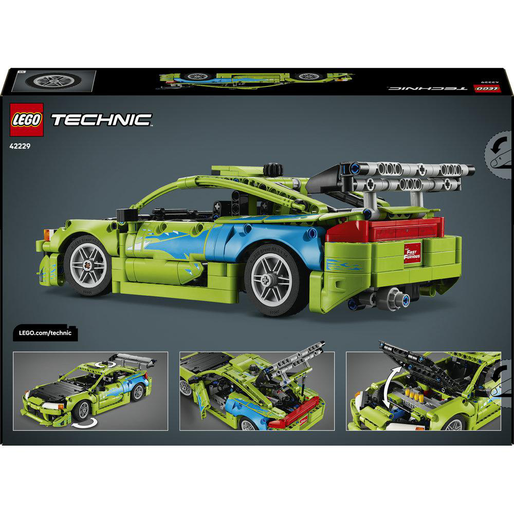 Grüner Lego Technic Rennwagen mit blauen Flammen, großem Heckspoiler und detailliertem Motor.