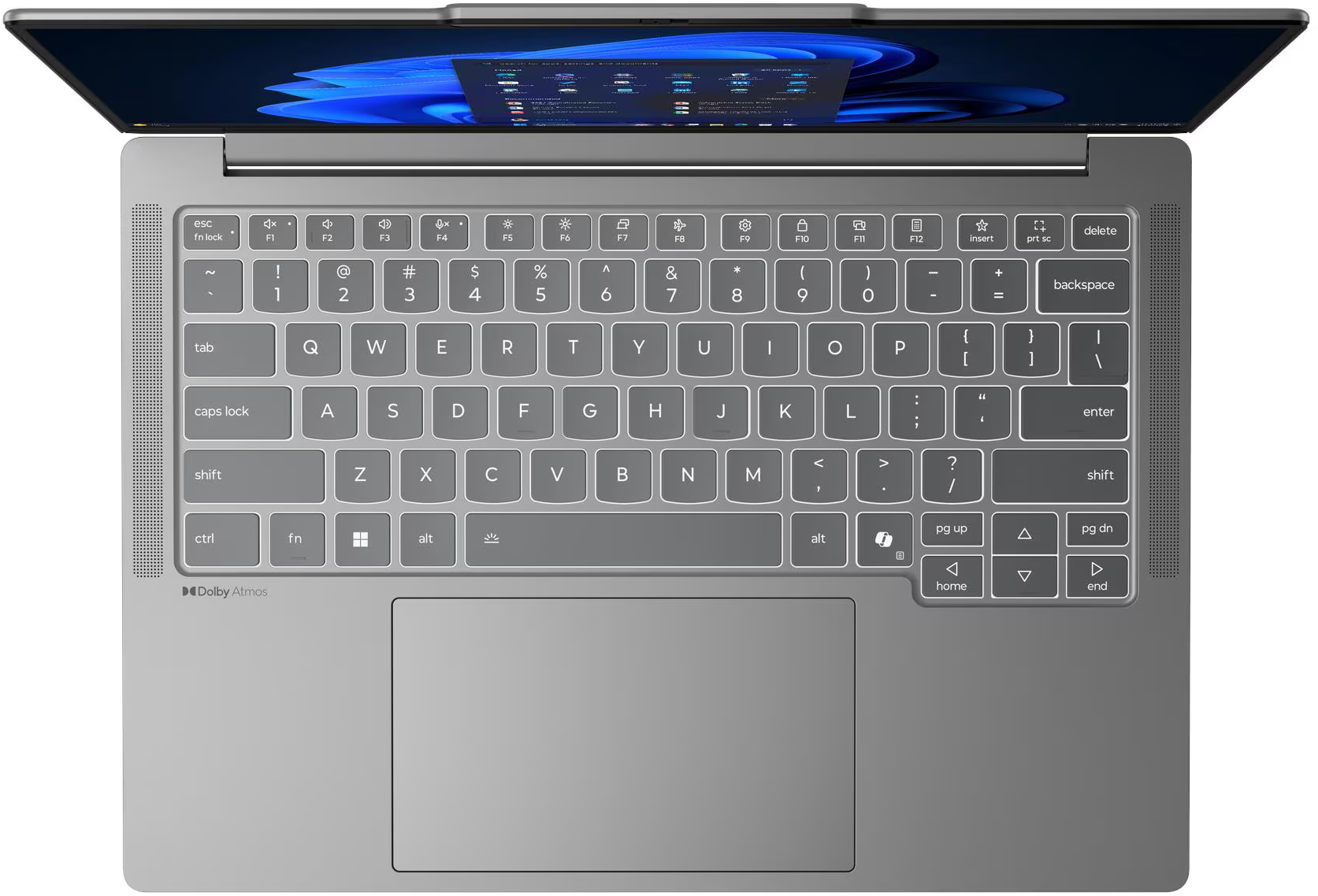 Ezüst laptop felülnézetben, nyitott képernyővel, Windows felülettel.
