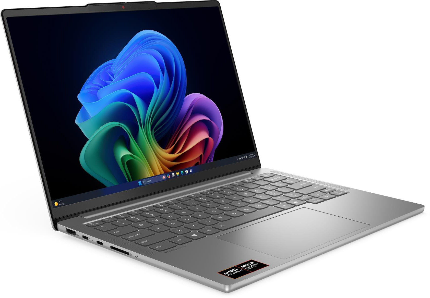 Ezüst laptop színes háttérképpel és billentyűzettel a képernyőn.