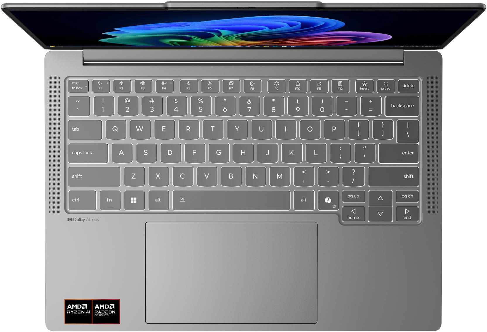 Egy nyitott laptop ezüst billentyűzettel és színes háttérrel a képernyőn.