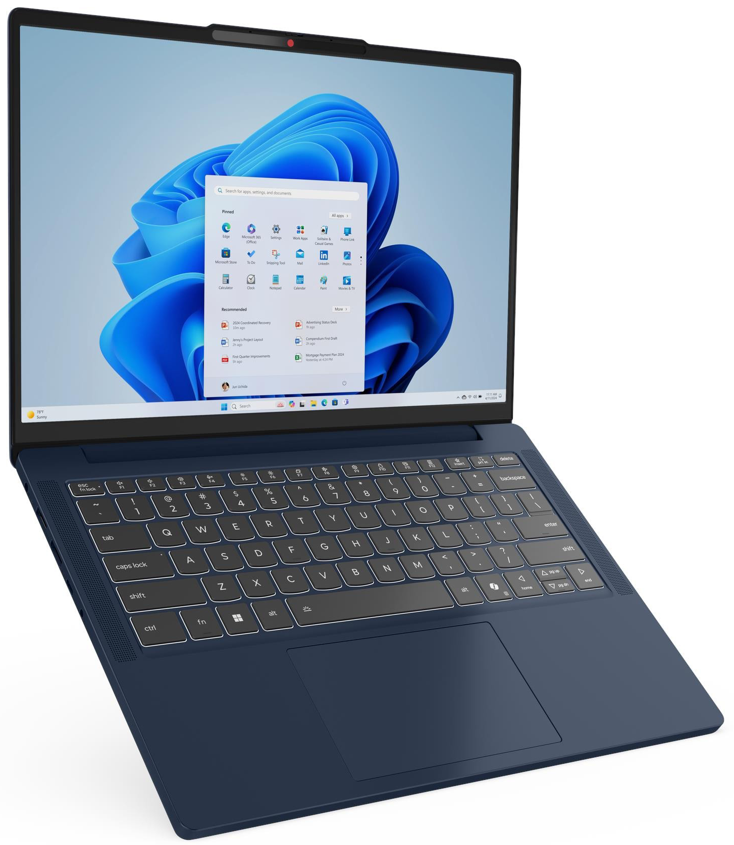 Sötétkék laptop nyitott Windows 11 menüvel és billentyűzettel.