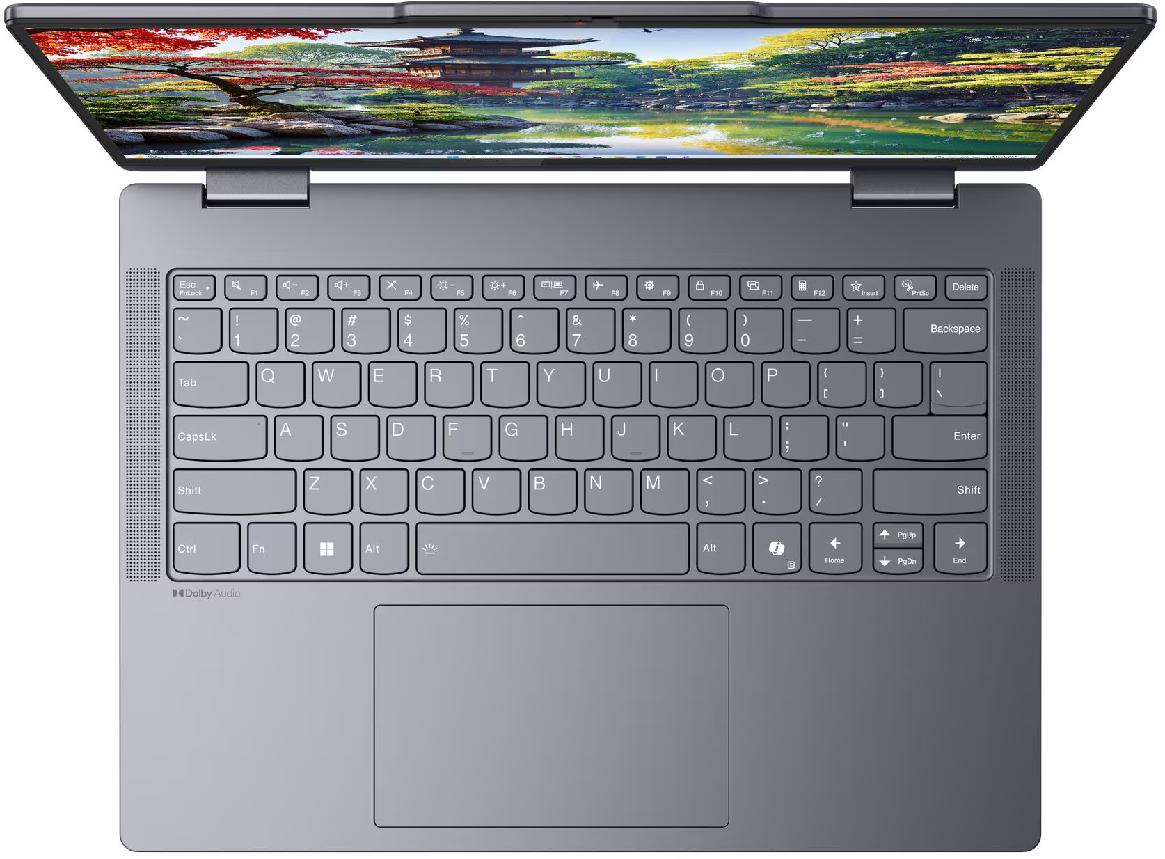 Egy nyitott laptop japán kertet mutat a képernyőjén.