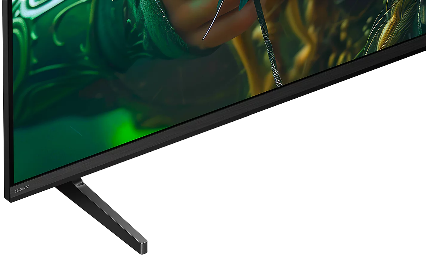 Egy Sony TV alsó sarka sötét kerettel és egy lábbal.
