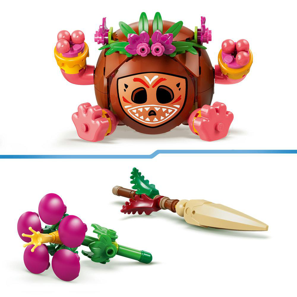 Ein LEGO-Charakter mit Kokosnusskopf und ein Speer mit Beeren.
