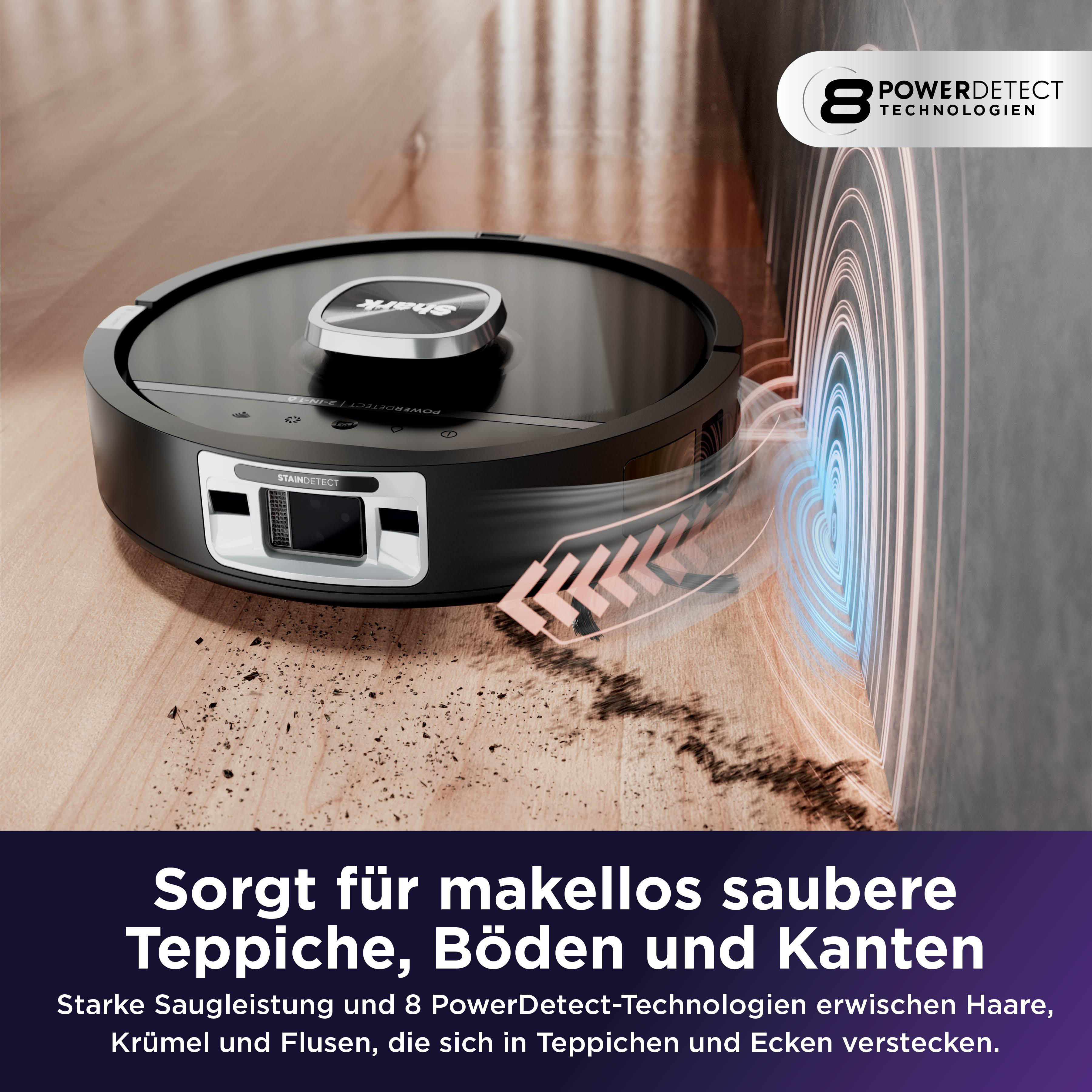 Ein Saugroboter reinigt einen Holzboden und saugt Schmutz auf.