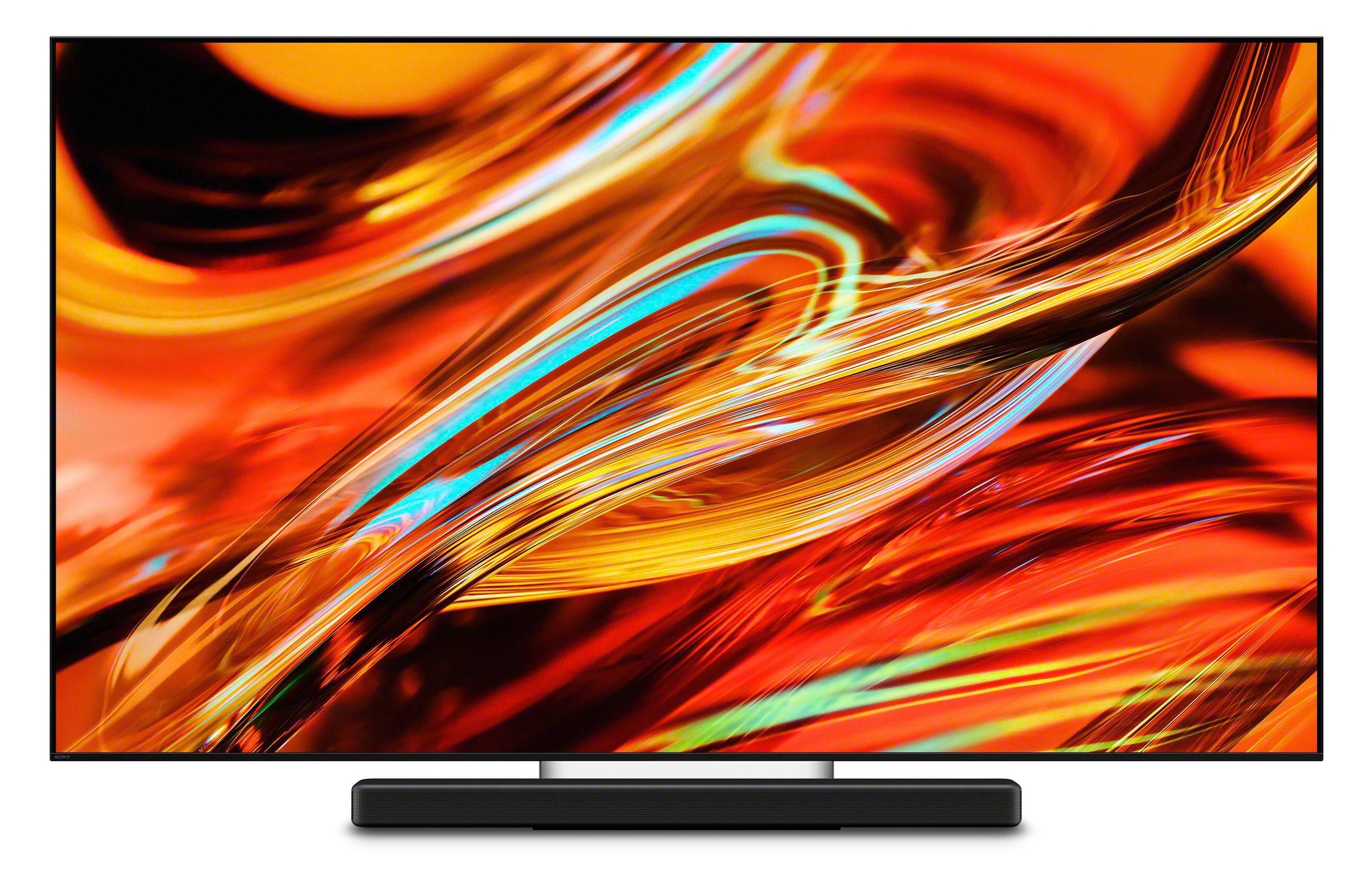 Nowoczesny telewizor z abstrakcyjnym, ognistym obrazem na ekranie i soundbarem poniż.