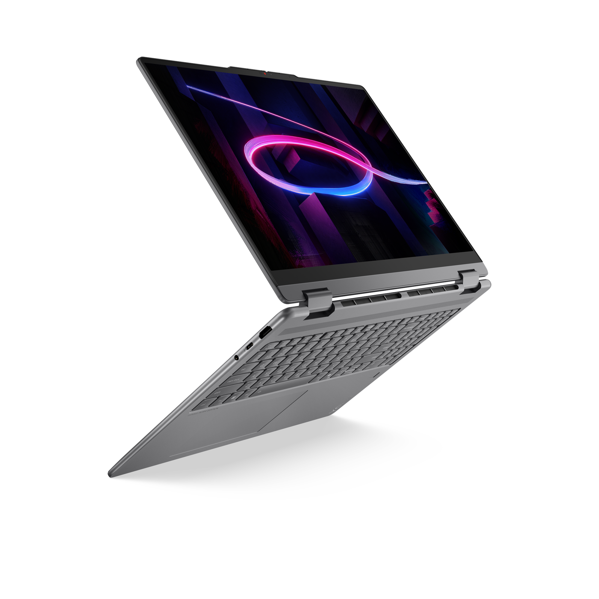 Ein offenes graues Laptop mit neonfarbenem Hintergrund auf schwarzem Hintergrund.