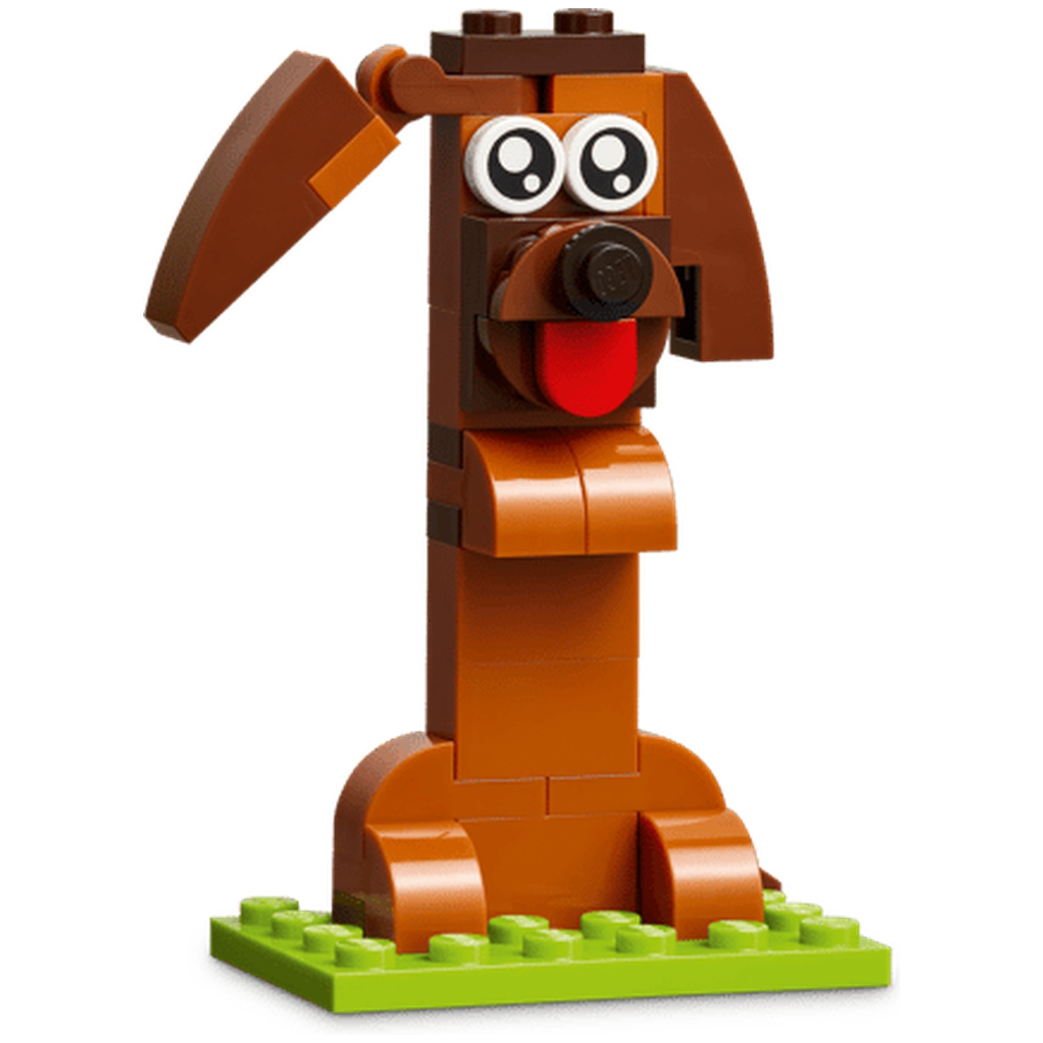 Un chien Lego marron avec une langue rouge, sur une base verte.