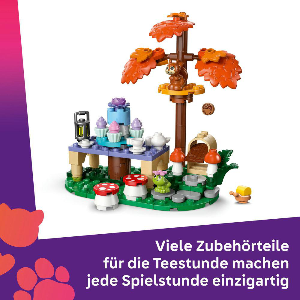 Ein Spielzeugwald mit Eichhörnchen, Frosch und Teegeschirr.
