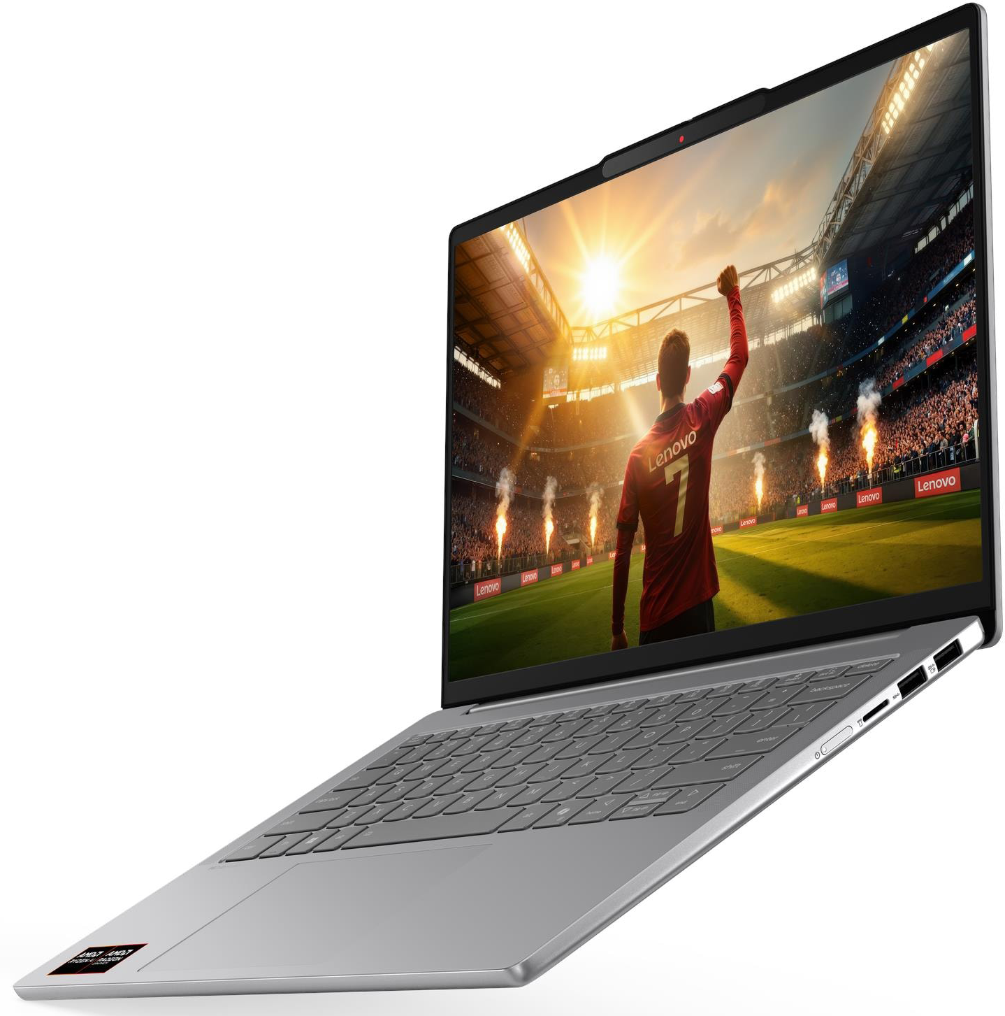 Egy laptopon focista látható stadionban, lelkes szurkolókkal és tűzijátékkal.