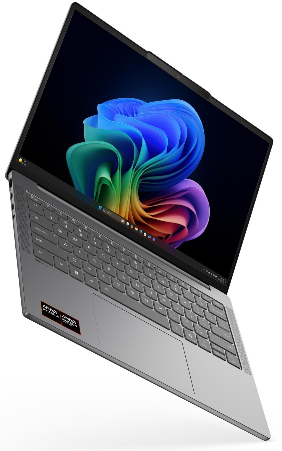 Ezüst laptop színes háttérképpel a képernyőn.